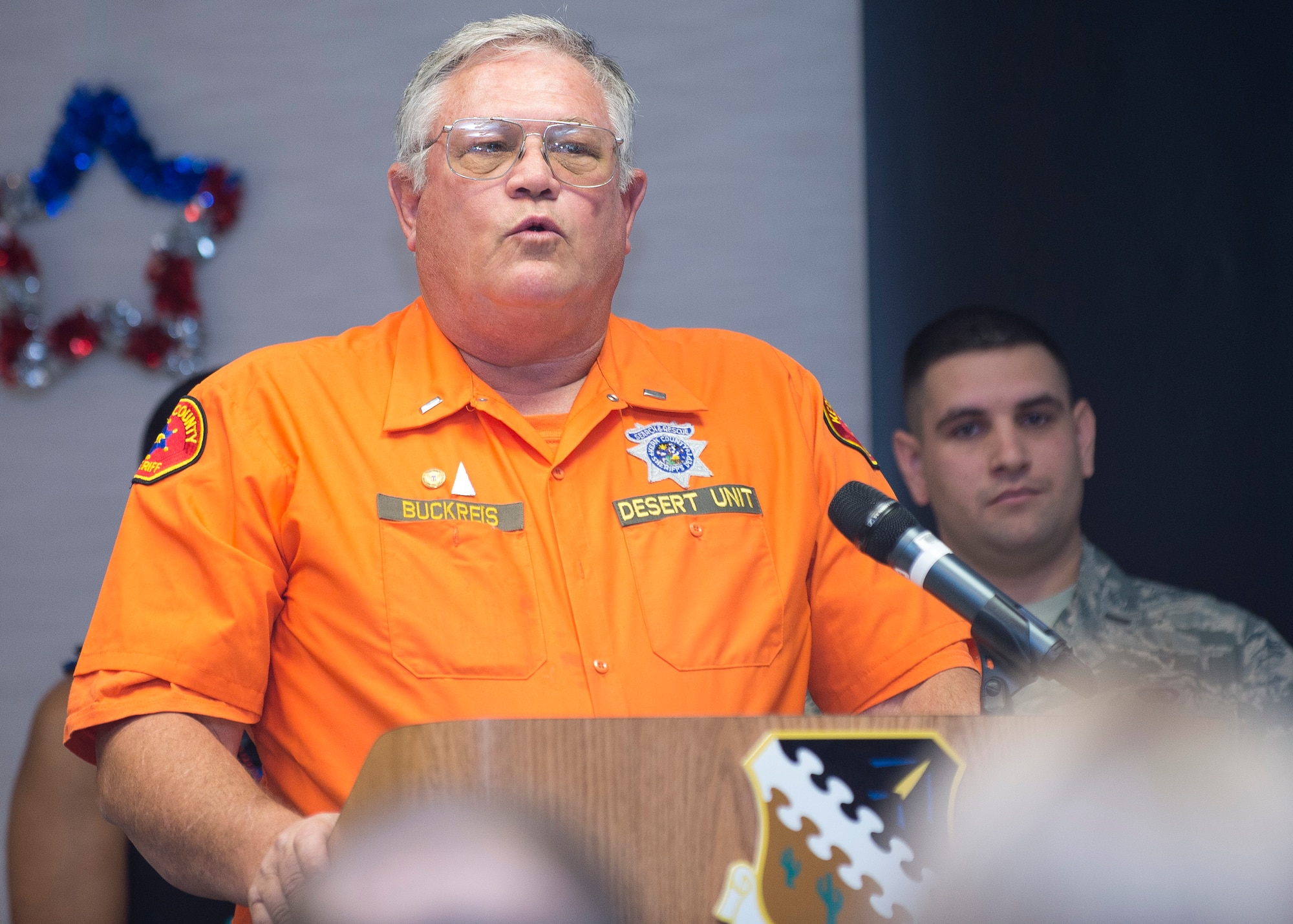 Guest Speaker, Richard Buckreis, Admininstrative Lieutenant for the Kern County Sheriff’s Desert Search and Rescue Group, was last year’s recipient of the Air Force Volunteer Excellence Award. This year, he spoke on the importance of volunteer work. (U.S. Air Force photo by Ethan Wagner)