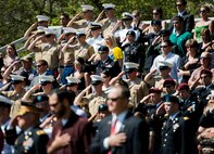 Army and Marine explosive ordnance disposal technicians salute during the 45th Annual EOD Memorial Ceremony May 3, at Eglin Air Force Base, Fla. Eight new names of Army and Marine EOD technicians, who lost their lives, were added to the wall this year.  The all-service total now stands at 306. (U.S. Air Force photo/Tech. Sgt. Sam King)