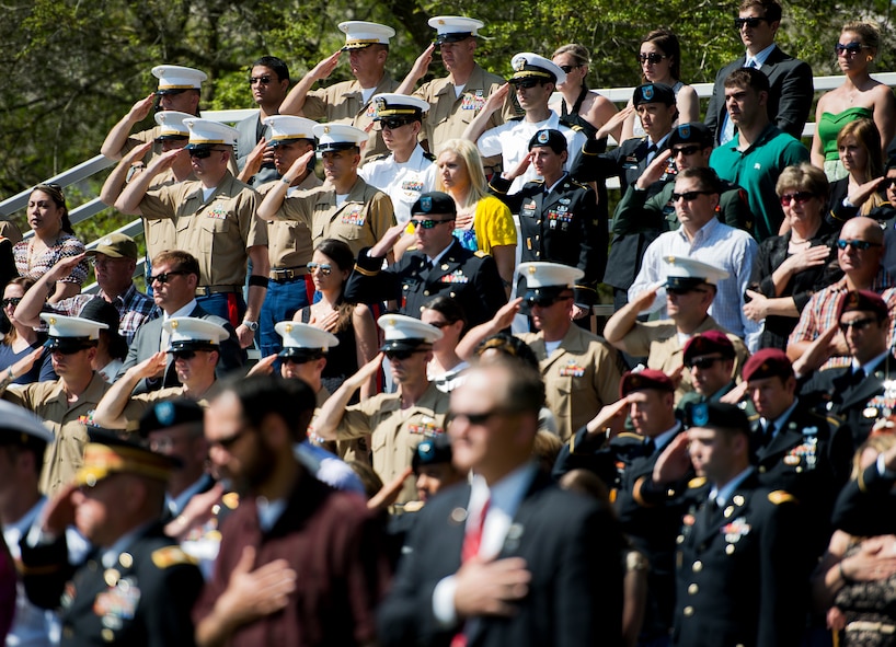 Army and Marine explosive ordnance disposal technicians salute during the 45th Annual EOD Memorial Ceremony May 3, at Eglin Air Force Base, Fla. Eight new names of Army and Marine EOD technicians, who lost their lives, were added to the wall this year.  The all-service total now stands at 306. (U.S. Air Force photo/Tech. Sgt. Sam King)
