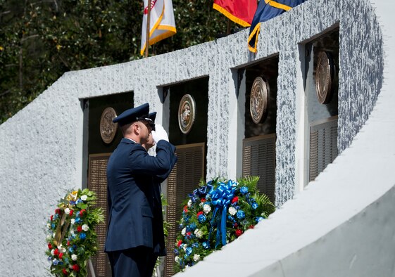 Maj. Mark Fogle and Chief Master Sgt. Neil Jones salute the Memorial Wall after the names of fallen Air Force explosive ordnance disposal technicians were read during the 45th Annual EOD Memorial Ceremony May 3, at Eglin Air Force Base, Fla. Eight new names of Army and Marine EOD technicians, who lost their lives, were added to the wall this year.  The all-service total now stands at 306. (U.S. Air Force photo/Tech. Sgt. Sam King)