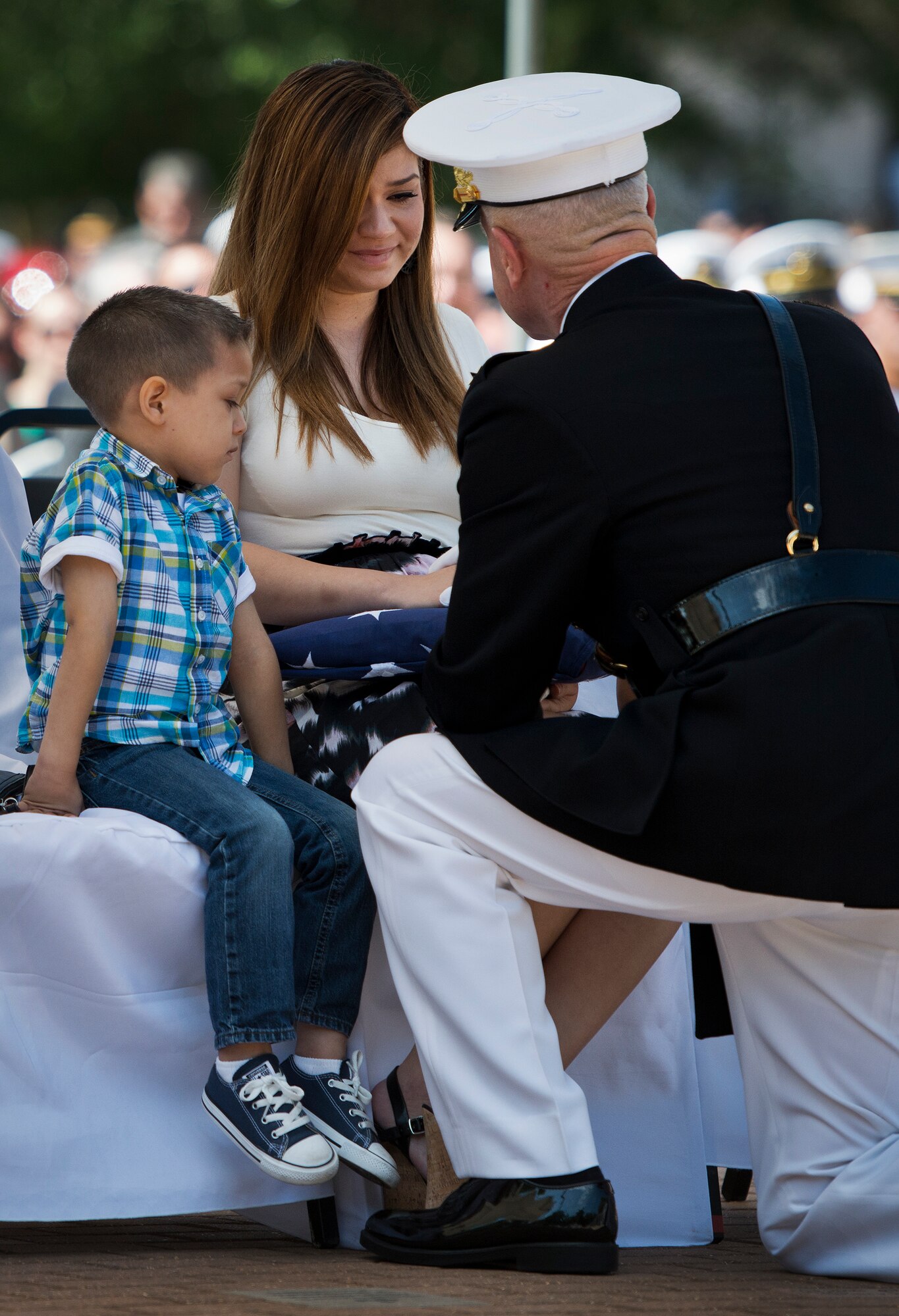 Susie Ortiz, widow of Sgt. Miguel Ortiz, speaks with Marine Corps Commandant Gen. Jim Amos during the 45th Annual Explosive Ordnance Disposal Memorial Ceremony May 3, at Eglin Air Force Base, Fla. Eight new names of Army and Marine EOD technicians, who lost their lives, were added to the Memorial Wall this year.  The all-service total now stands at 306. (U.S. Air Force photo/Tech. Sgt. Sam King)