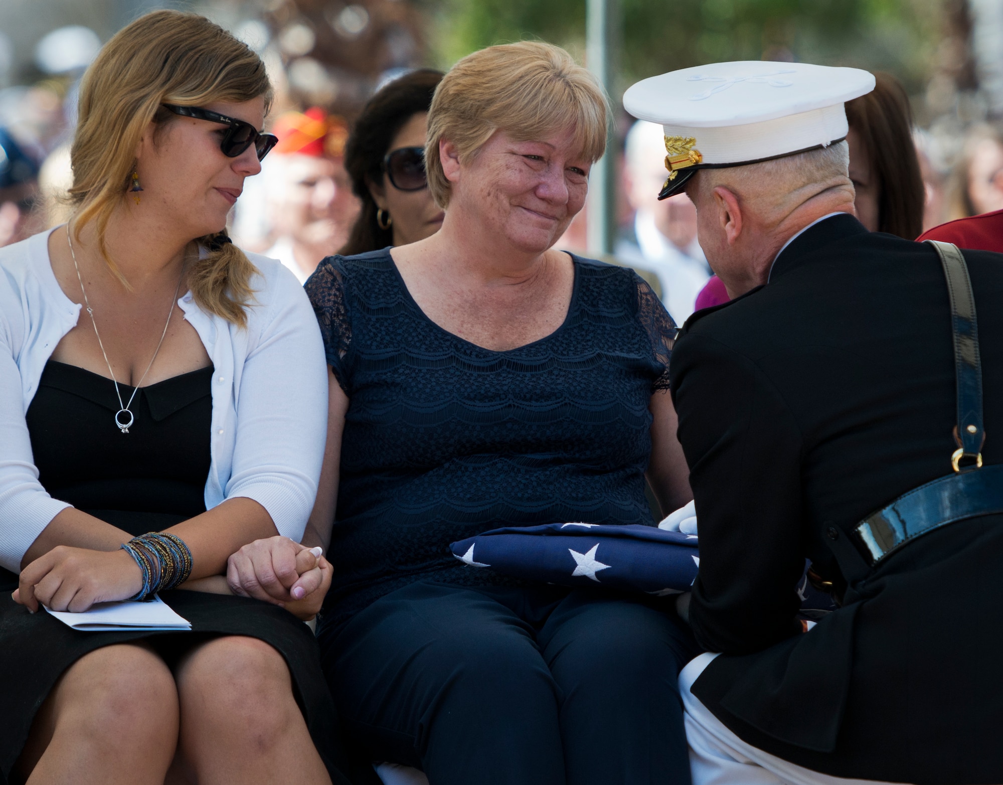 Monica Marsh, mother of Staff Sgt. Mathew Marsh, listens to Marine Corps Commandant Gen. Jim Amos during the 45th Annual Explosive Ordnance Disposal Memorial Ceremony May 3, at Eglin Air Force Base, Fla. Eight new names of Army and Marine EOD technicians, who lost their lives, were added to the Memorial Wall this year.  The all-service total now stands at 306. (U.S. Air Force photo/Tech. Sgt. Sam King)