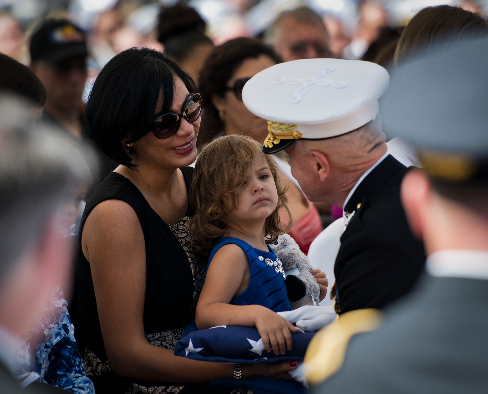 Violeta Mullins, widow of Gunnery Sgt. Greg Mullins, and their daughter Giovanna, speak with Marine Corps Commandant Gen. Jim Amos during the 45th Annual Explosive Ordnance Disposal Memorial Ceremony May 3, at Eglin Air Force Base, Fla. Eight new names of Army and Marine EOD technicians, who lost their lives, were added to the Memorial Wall this year.  The all-service total now stands at 306. (U.S. Air Force photo/Tech. Sgt. Sam King)