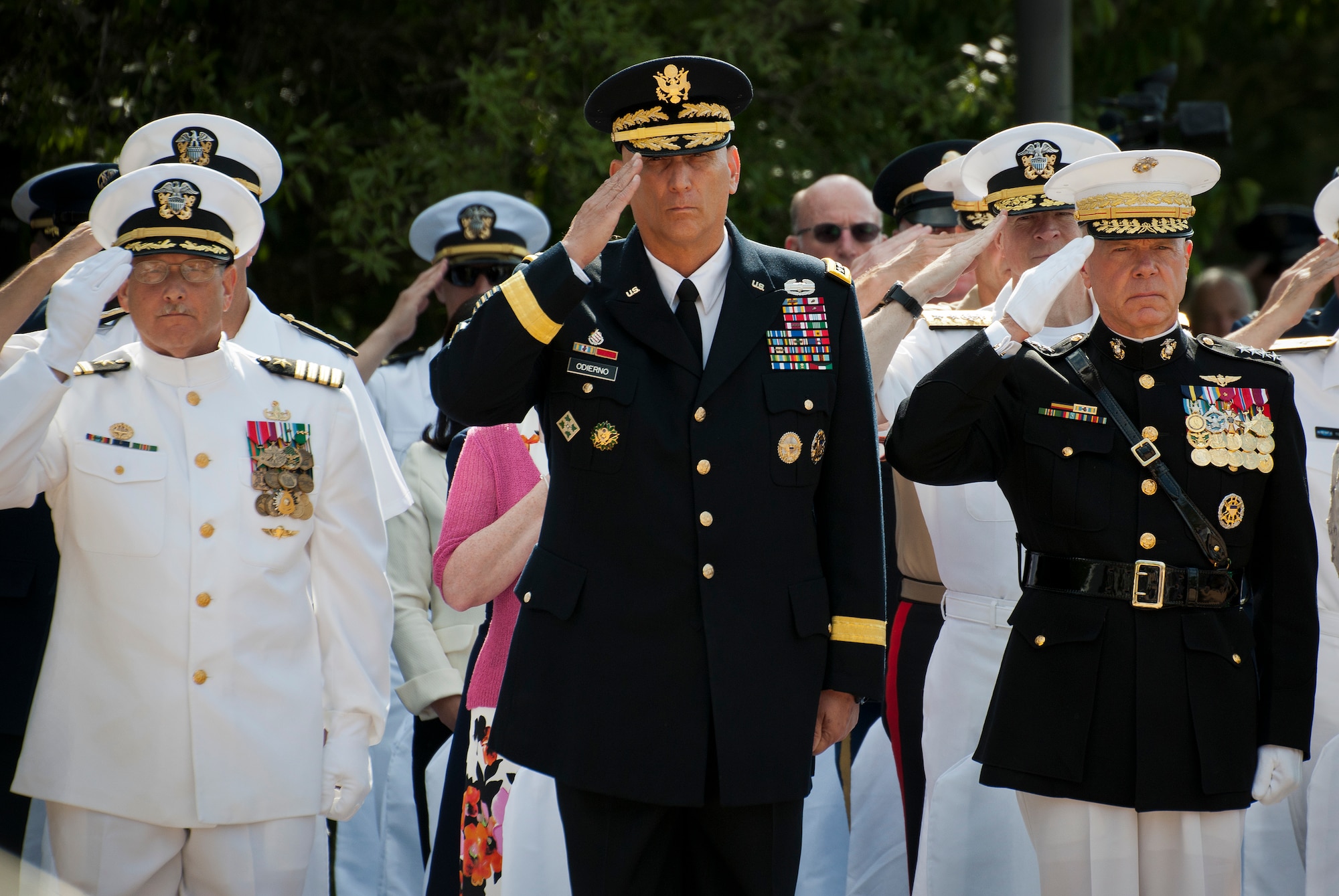 Capt. William Noel, Navy School EOD commandant, Army Chief of Staff Gen. Ray Odierno and Marine Corps Commandant Gen. Jim Amos salute during the presentation of the colors at the 45th Annual Explosive Ordnance Disposal Memorial Ceremony May 3, at Eglin Air Force Base, Fla. Odierno, the event guest-speaker, spoke to each of the Army families as folded flags were presented to them.  Amos presented a flag to each of the families of the fallen Marines.  Eight new names of Army and Marine EOD technicians, who lost their lives, were added to the Memorial Wall this year.  The all-service total now stands at 306. (U.S. Air Force photo/Tech. Sgt. Sam King)