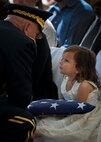 Army Chief of Staff Gen. Ray Odierno comforts Audrey Baker, daughter of Sgt. 1st Class Jeff Baker, during the 45th Annual Explosive Ordnance Disposal Memorial Ceremony May 3, at Eglin Air Force Base, Fla. Eight new names of Army and Marine EOD technicians, who lost their lives, were added to the Memorial Wall this year.  The all-service total now stands at 306. (U.S. Air Force photo/Tech. Sgt. Sam King)
