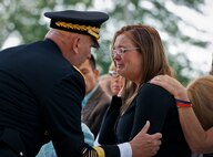 Army Chief of Staff Gen. Ray Odierno comforts Mandi Bennett, widow of Staff Sgt. Wade Bennett, during the 45th Annual Explosive Ordnance Disposal Memorial Ceremony May 3, at Eglin Air Force Base, Fla. Eight new names of Army and Marine EOD technicians, who lost their lives, were added to the Memorial Wall this year.  The all-service total now stands at 306. (U.S. Air Force photo/Tech. Sgt. Sam King)