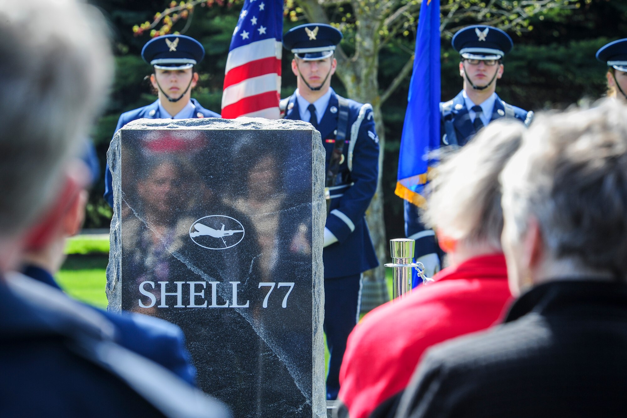 Family, friends, coworkers and neighbors of three fallen Fairchild Airmen who tragically perished one year ago in a KC-135 Stratotanker crash in northern Kyrgyzstan reflect during a memorial dedication ceremony in the Fairchild Memorial Grove Park at Fairchild Air Force Base, Wash., May 3, 2014. "Shell 77" crewmembers honored were Capt. Mark T. "Tyler" Voss, Capt. Victoria A. "Tori" Pinckney and Tech. Sgt. Herman "Tre" Mackey III. During the ceremony, a granite memorial featuring a centerpiece and three benches were unveiled honoring these three Airmen keeping their memory alive at Fairchild. (U.S. Air Force photo by Staff Sgt. Benjamin W. Stratton/Released)