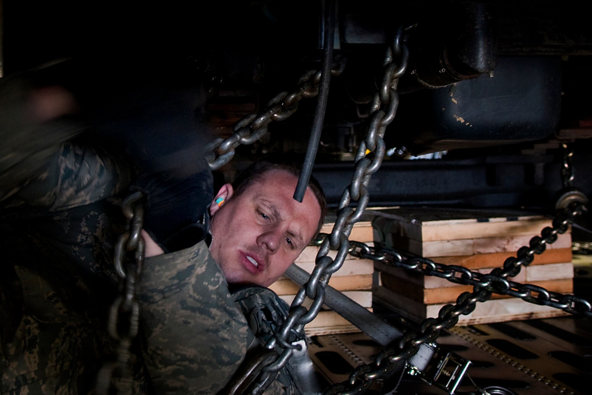 Tech. Sgt. Thomas Greening, 49th Aerial Port Squadron aerial port specialist from Grissom Air Reserve Base, Ind., secures a fire truck inside a C-17 Globemaster III aircraft at Grissom April 25, 2014, during a Patriot Warrior exercise. Patriot Warrior is a joint, field-training exercise for theater aeromedical evacuation systems and ground medical components designed to replicate all aspects of combat medical service support. (U.S. Air Force photo/Tech. Sgt. Mark R. W. Orders-Woempner)
