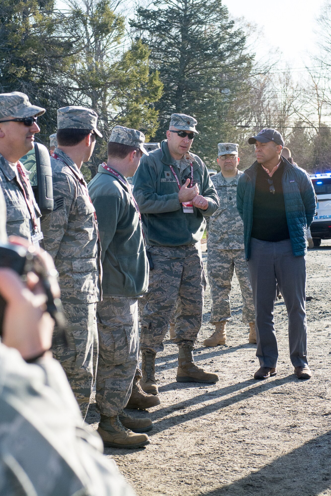 Members of the 102nd Medical Group give a mission briefing to Massachusetts Gov. Deval Patrick before the kick-off of the 118th Boston Marathon. The Massachusetts National Guard continues to support local authorities at the Boston Marathon every year. (Air National Guard photo by Tech. Sgt. Kerri Spero/Released)