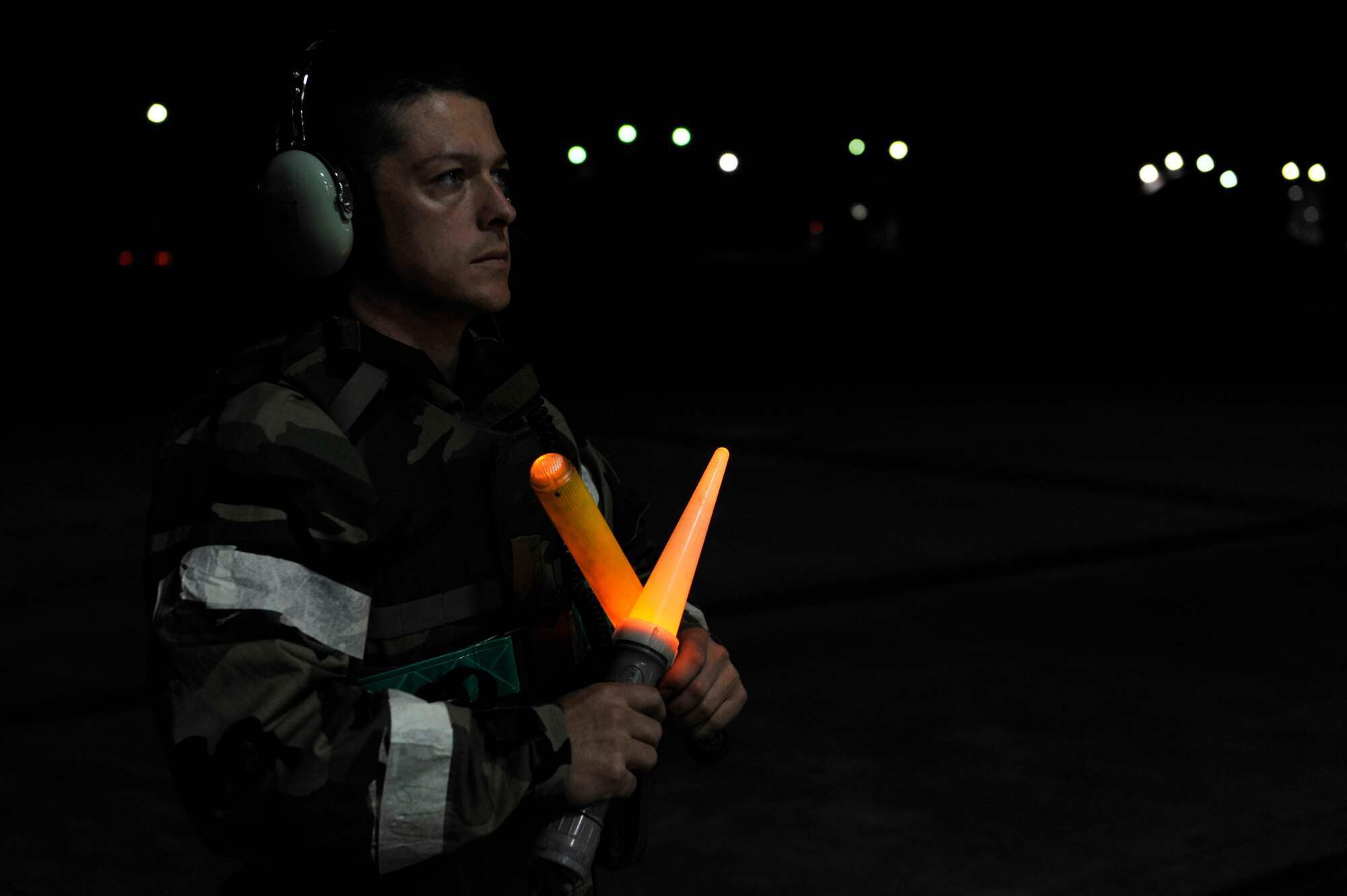 A 25th Aircraft Maintenance Unit crew chief holds an A-10 pilot during one of the simulated combat sorties May 5 in a hangar on Osan Air Base, Republic of Korea. The Beverly Bulldog 14-02 exercise will allow the base to practice integrating its operational and tactical units, and test its ability to effectively conduct noncombatant evacuation operations. (U.S. Air Force photo by Senior Airman David Owsianka)