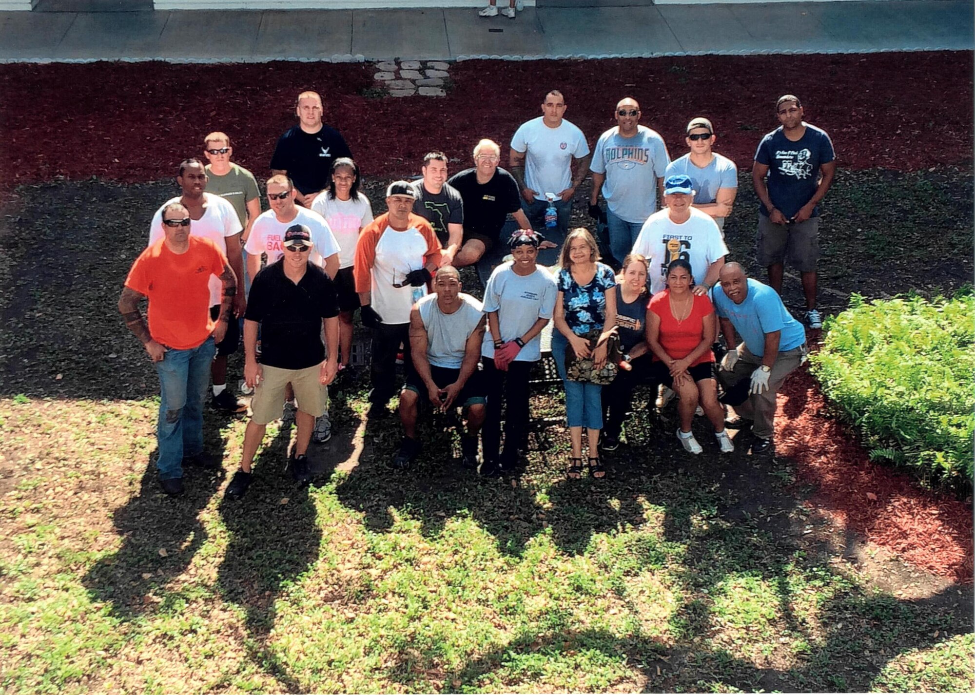 Volunteers take a break from a "Spring Workday" clean-up community event at
Campbell Drive K-8 Center in Homestead, Fla. Armed with shovels and rakes,
more than 12 volunteers from Team Homestead Air Reserve Base helped clean-up the school April 26. (Courtesy Photo)
