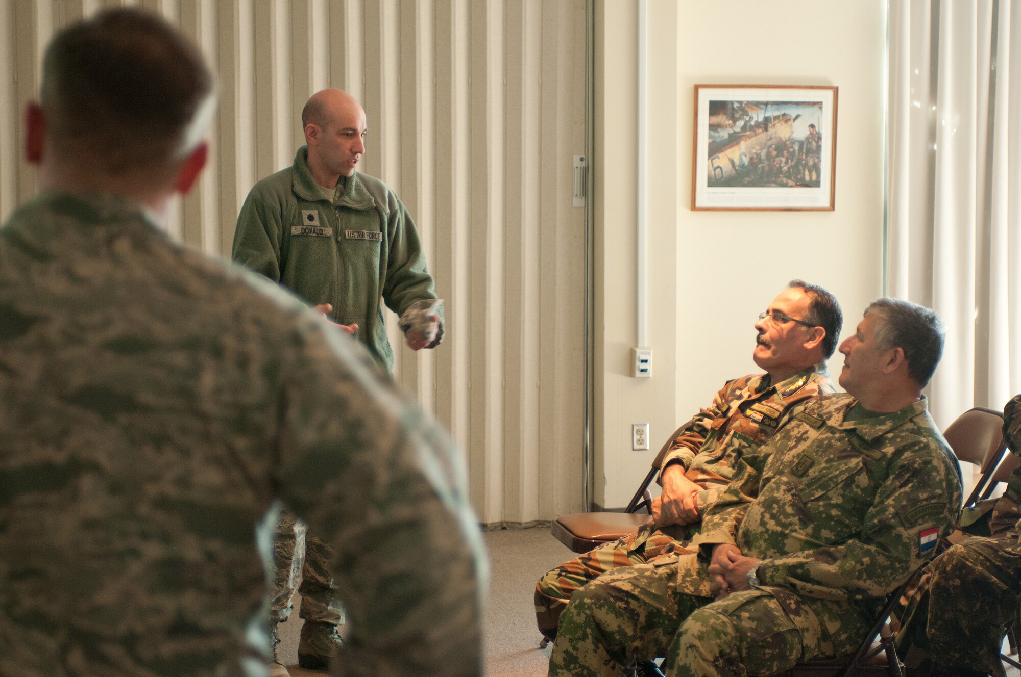 Col. James Lefavor hosts high-ranking Paraguayan officers and their aides on April 16, 2014 as they visit Otis Air National Guard base during their week-long trip to Massachusetts. Maj. Gen. Carlos Antonio Caballero Maidana and Brig. Gen. Aparicio Diego Zarate Vidal, of the Paraguayan Army and Air Force, were visiting Massachusetts as part of the State Partnership Program. The National Guard program pairs a state's National Guard with the armed forces or equivalent of a partner country in a cooperative, mutually beneficial relationship. (National Guard photo by Master Sgt. Aaron Smith / Released)