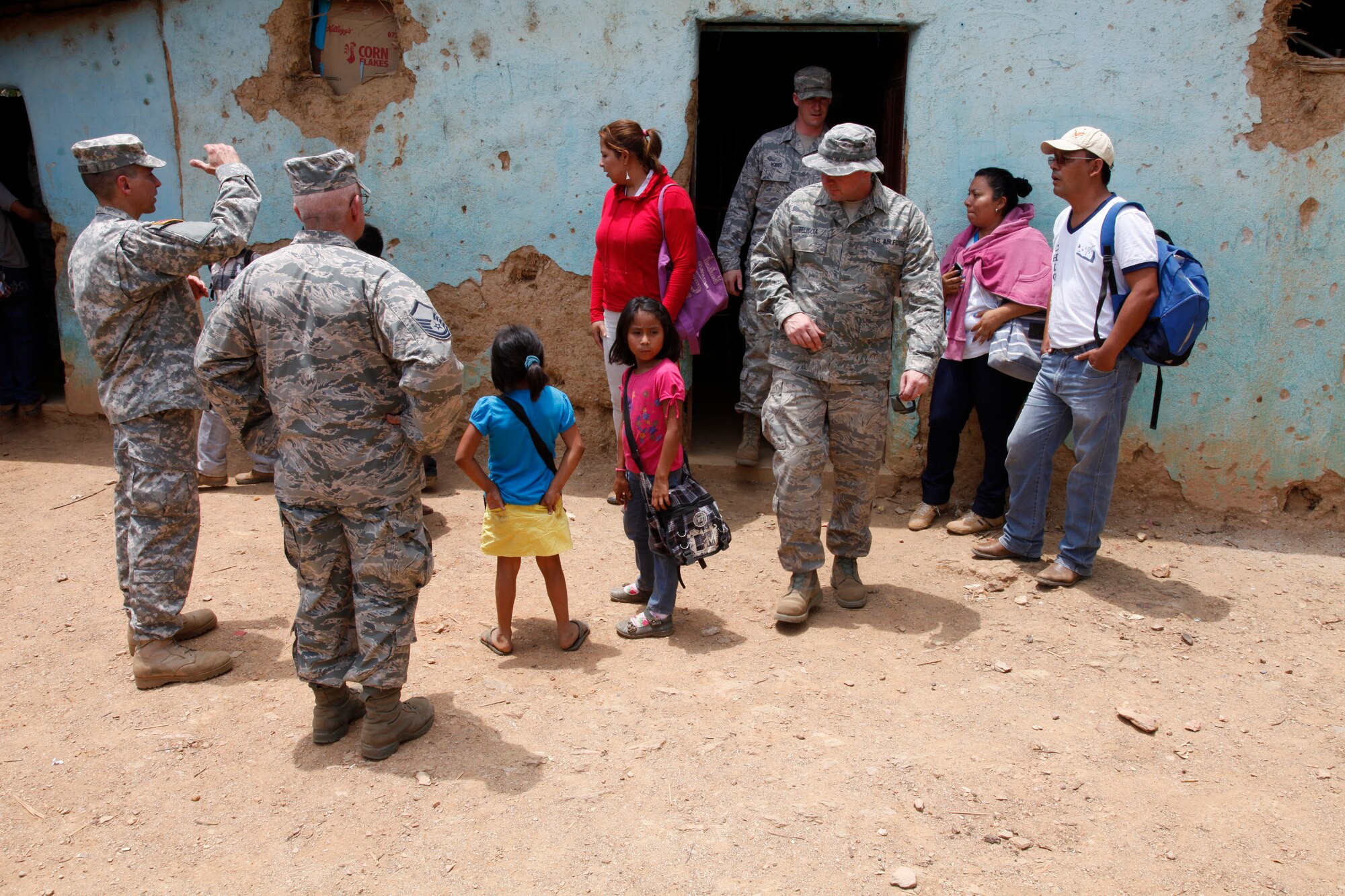 Guatemalan, U.S. Army, and 188th Civil Engineer Squadron Airmen meet with school children in El Robles, Guatemala April 7, 2014 during Beyond the Horizons, which is a U.S. partnership with the government of Guatemala conducting various medical, dental and civic actions programs, providing focused humanitarian assistance. (U.S. Army photo by Sgt. 1st Class Marcus J. Quarterman)