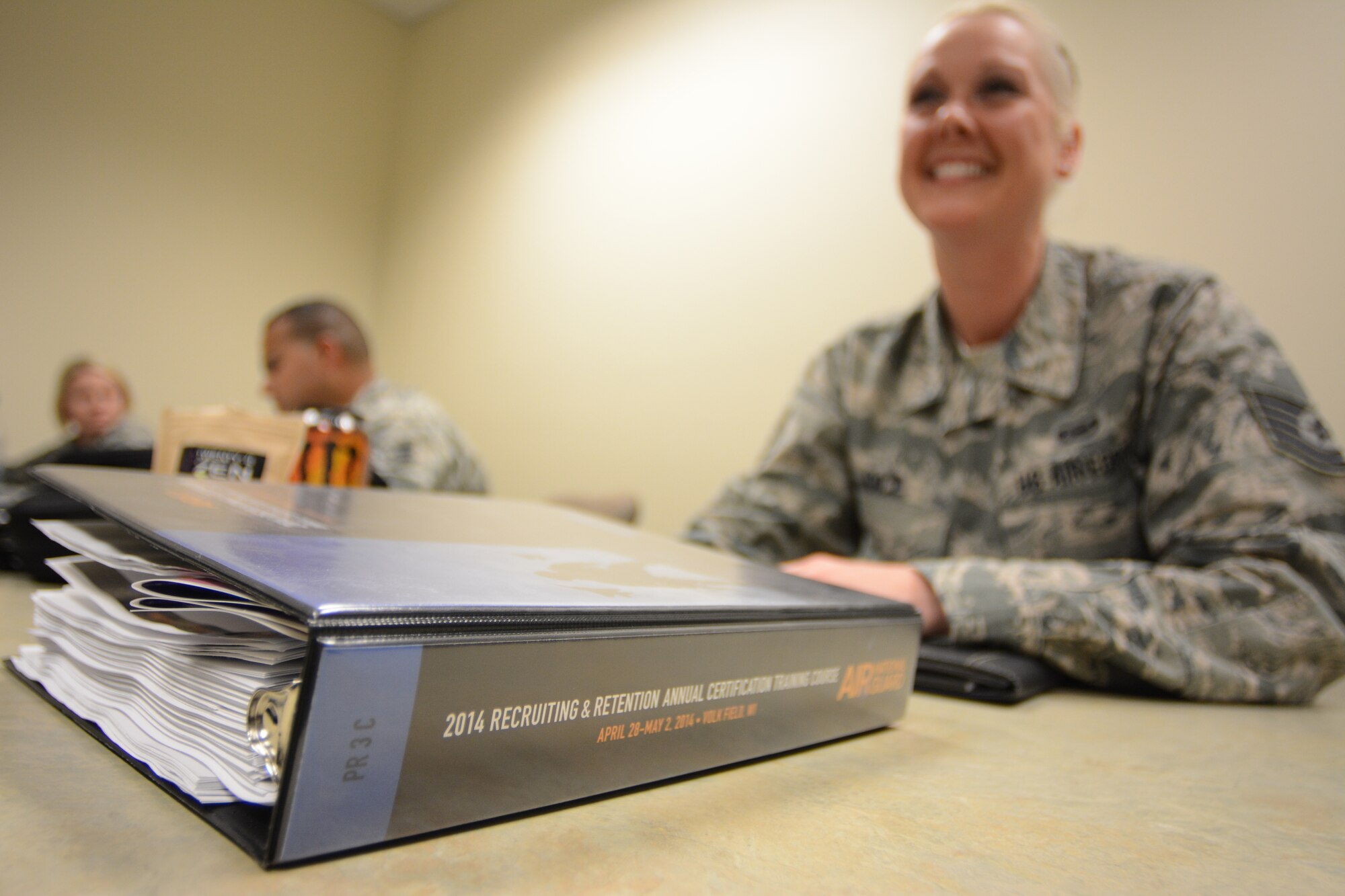 Air National Guard recruiters were given binders full of training information to utilize during the 2014 Recruiting and Retention Annual Certification Training Course at Volk Field Air National Guard Base, Wis., April 28, 2014. More than 600 recruiters from across the nation attended the event April 27-May 2. (Air National Guard photo by Senior Airman Andrea F. Liechti)