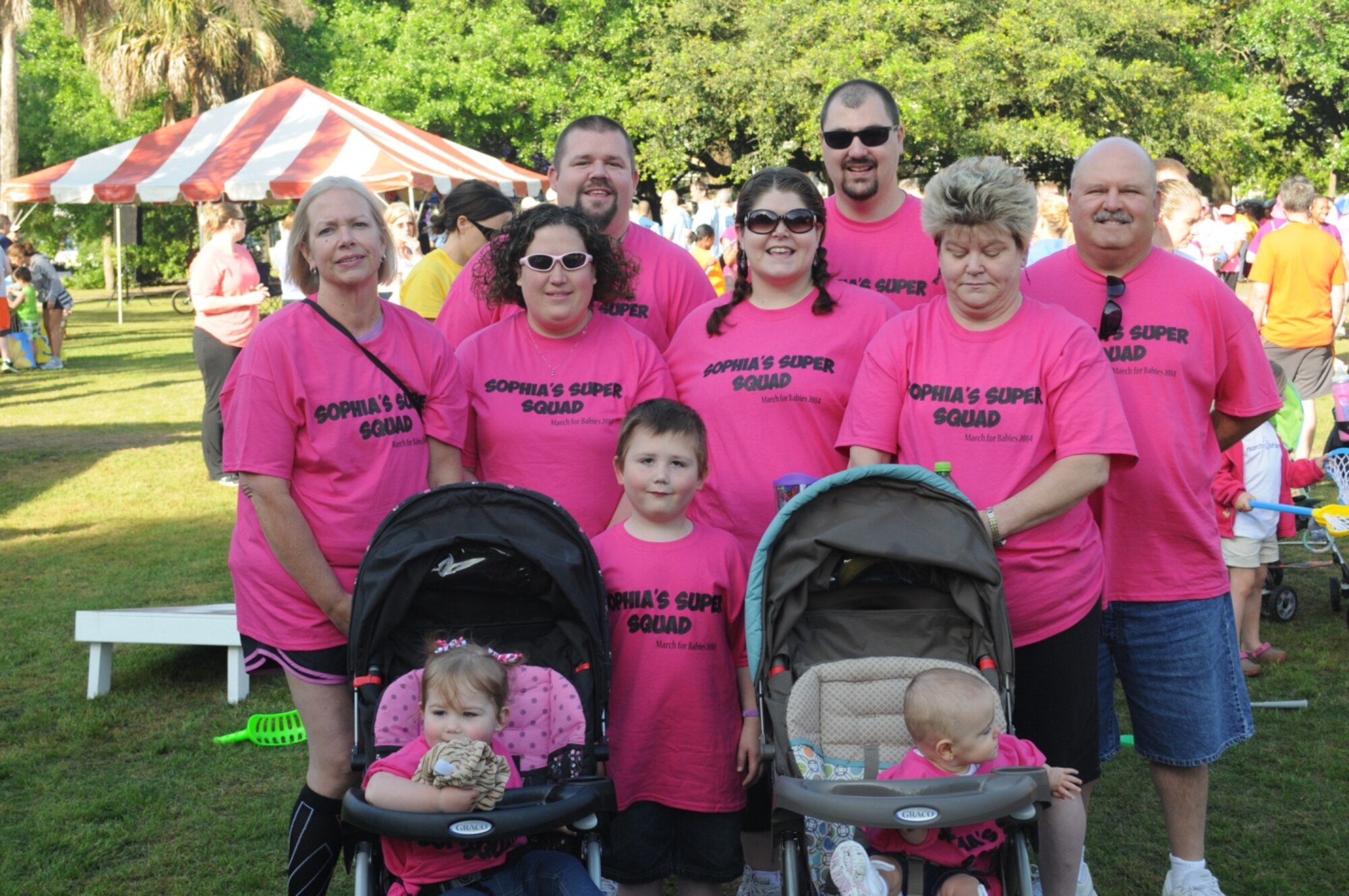 Sheryl Sande (far left) and Glenn Caddell (far right), 841st Transportation Battalion civilians, walked for team “Sophie’s Super Squad” with Sophie (front left) leading the way.