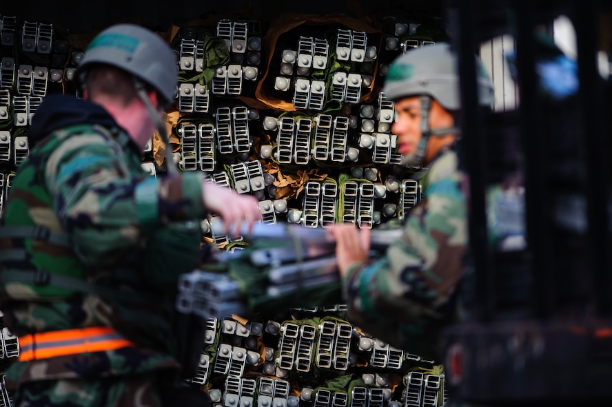 Airmen from the 8th Force Support Squadron prepare cots for a large scale bed down at Kunsan Air Base, Republic of Korea, May 5, 2014. During Exercise Beverly Bulldog, the bed down system allowed the Wolf Pack to test and showcase its ability to “Accept Follow on Forces.” (U.S. Air Force photo by Senior Airman Armando A. Schwier-Morales/Released)