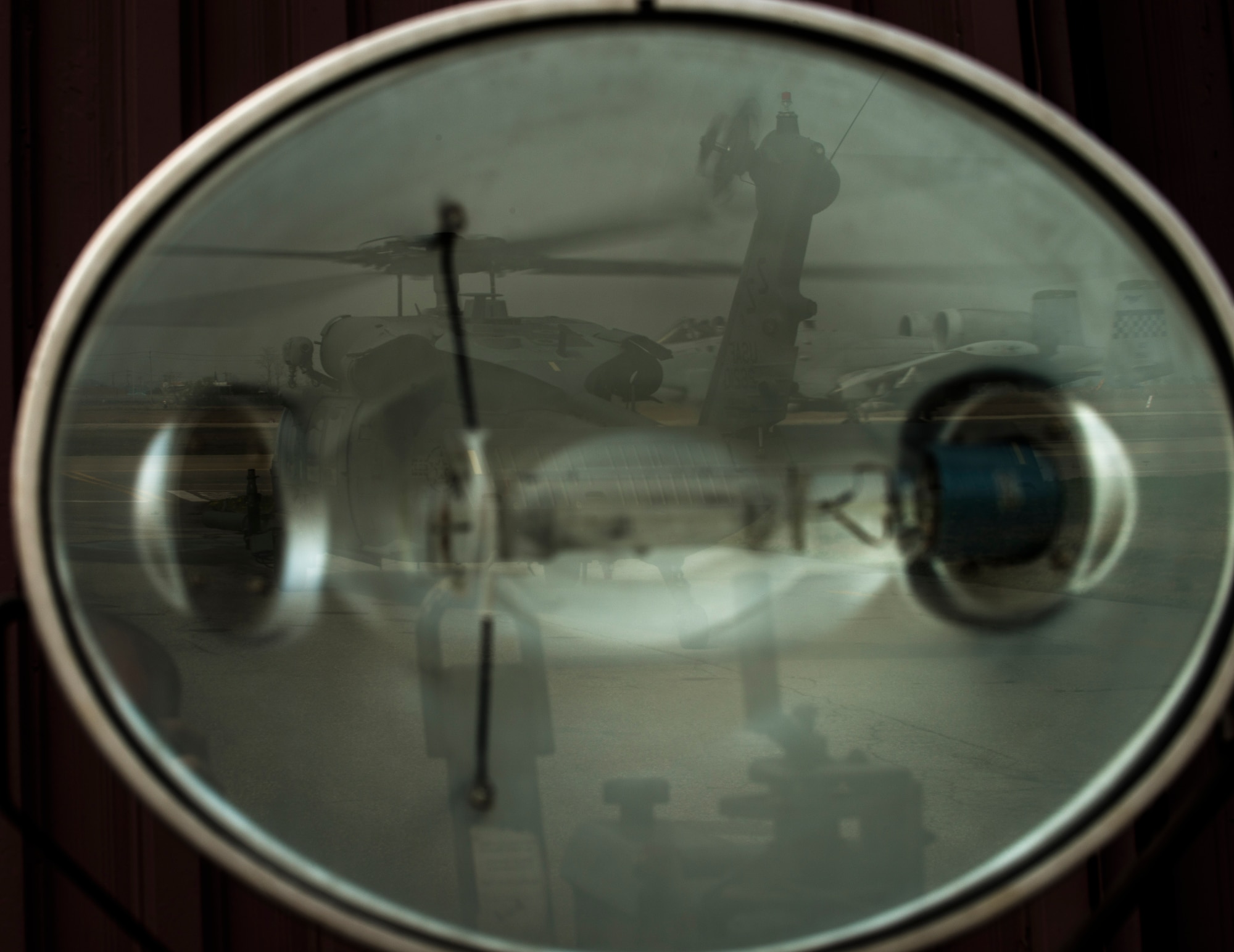 An HH-60 Pave Hawk stands by as an A-10 taxis for takeoff during exercise Pacific Thunder April 18, 2014, at Osan Air Base, Republic of Korea. The week-long exercise was designed to test the contingency abilities of U.S. and RoK forces. (U.S. Air Force photo by Staff Sgt. Jake Barreiro)