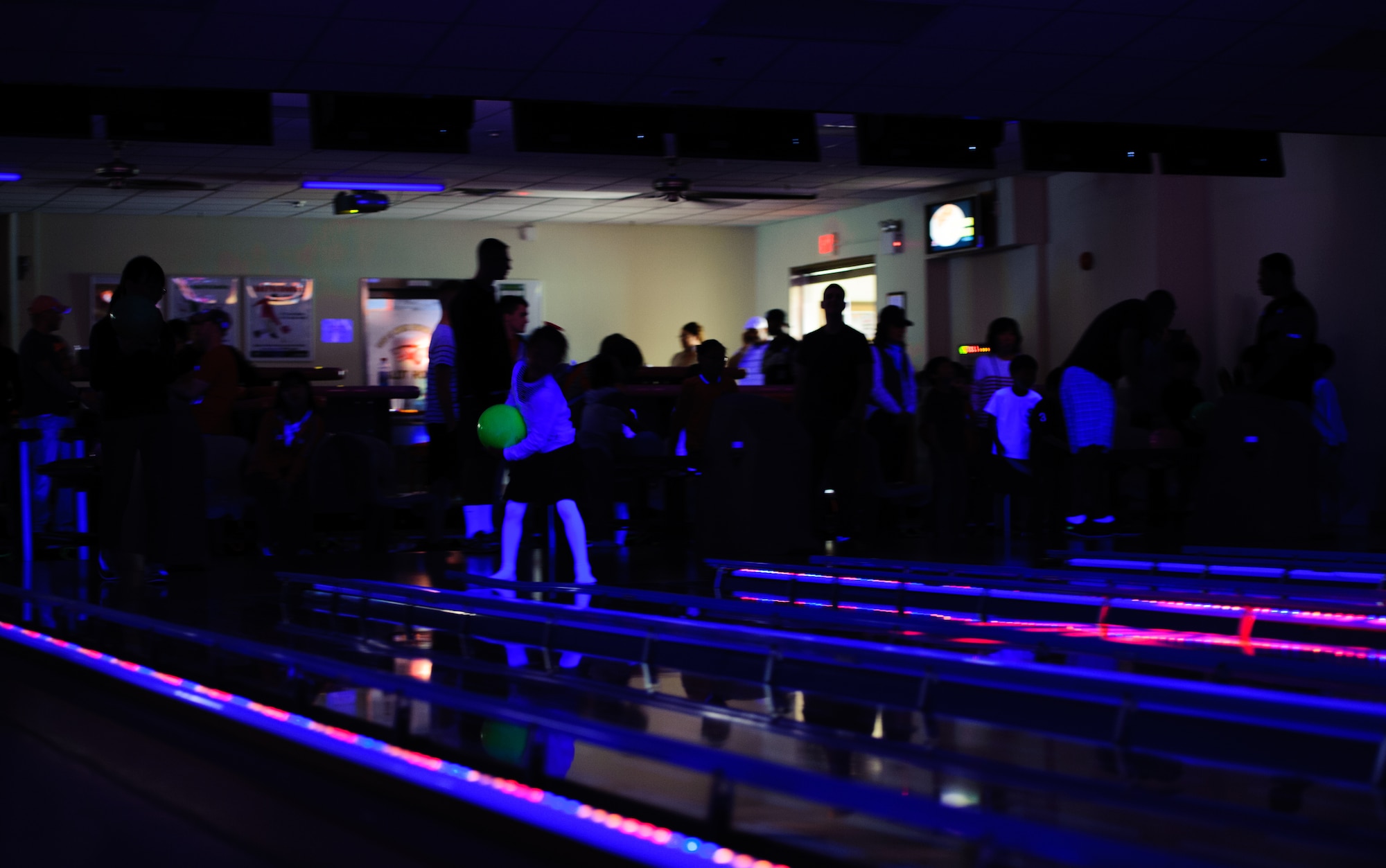 Airmen and children from a local orphanage bowl during an event hosted by Kunsan’s 8th Security Forces Squadron at Kunsan Air Base, Republic of Korea, May 3, 2014. The squadron gave children a chance to bowl and spend time with Airmen that regularly visit the orphanage. (U.S. Air Force photo by Senior Airman Armando A. Schwier-Morales/Released)