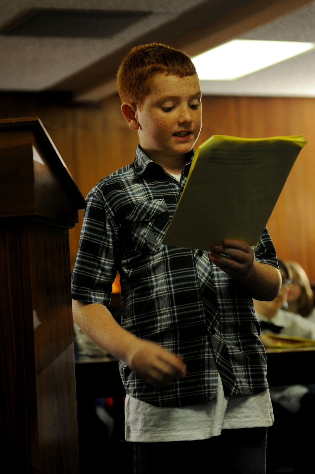 Kaden Traylor, Alconbury Elementary School student and defense attorney for Benjamin Bradley Wolf, cross-examines a witness during the 2014 Law Day mock trial at RAF Alconbury, United Kingdom, May 1, 2014. Law Day allows students to apply civics and social studies lessons in a realistic setting and serves as a partnership between the 501st Combat Support Wing Judge Advocate Office and Alconbury Elementary. (U.S. Air Force photo by Staff Sgt. Jarad A. Denton/Released)