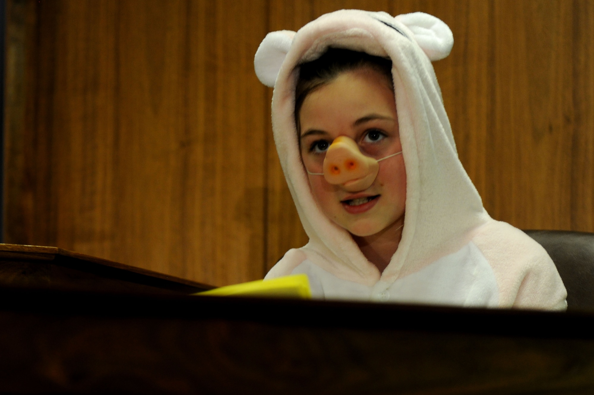 The first little pig, portrayed by Alconbury Elementary School student Cheyanne Storie, delivers her testimony during the mock trial of Benjamin Bradley Wolf at RAF Alconbury, United Kingdom, May 1, 2014. The trial, part of the 2014 Law Day and hosted by the 501st Combat Support Wing Judge Advocate Office, allowed the students to see the inner workings of an actual courtroom. (U.S. Air Force photo by Staff Sgt. Jarad A. Denton/Released)
