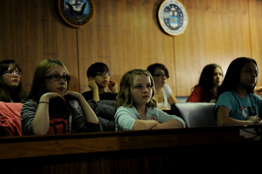 Members of the Alconbury Elementary School jury listen as the trial of Benjamin Bradley Wolf is presented during the 2014 Law Day at RAF Alconbury, United Kingdom, May 1, 2014. The mock trial was held as a partnership between the 501st Combat Support Wing Judge Advocate Office and Alconbury Elementary School as an entertaining lesson on the importance of voting and the rule of law. (U.S. Air Force photo by Staff Sgt. Jarad A. Denton/Released)
