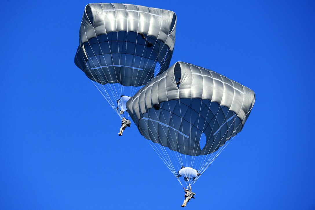 U.S. paratroopers conduct a training jump from a CH-47 Chinook helicopter into Bunker Drop Zone at the 7th Army Joint Multinational Training Command's Grafenwoehr Training Area in Grafenwoehr, Germany, Nov. 12, 2013. The paratroopers are assigned to the 173rd Infantry Brigade Combat Team.  