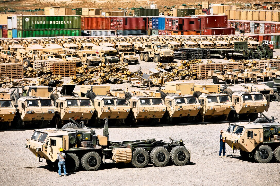 Rows of heavy vehicles fill a retrograde yard before shipment on Camp Warrior, Bagram Airfield, Afghanistan, Oct. 2, 2013.  