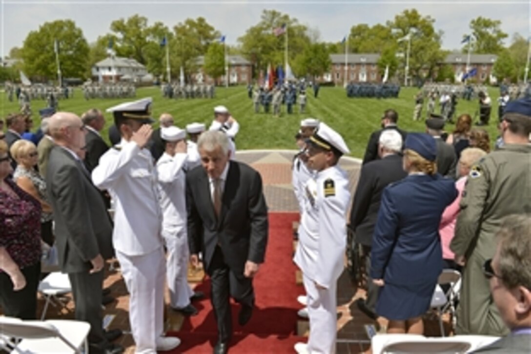 Defense Secretary Chuck Hagel receives salutes from side boys as he departs the U.S. Transportation Command's change-of-command ceremony on Scott Air Force Base, Ill., May 5, 2014. During the ceremony, Hagel welcomed Air Force Gen. Paul J. Selva as the incoming commander and presided over the retirement of Air Force Gen. William M. Fraser III after 40 years of service.