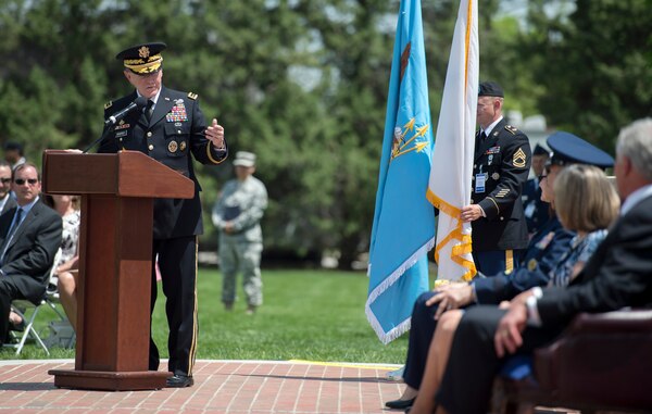 Gen. Martin E. Dempsey, chairman of the Joint Chiefs of Staff, speaks at the change of command and retirement ceremony of Gen. William M. Fraser III, outgoing commander of U.S. Transportation Command, on the parade field of Scott Air Force Base, Ill., May 5, 2014.