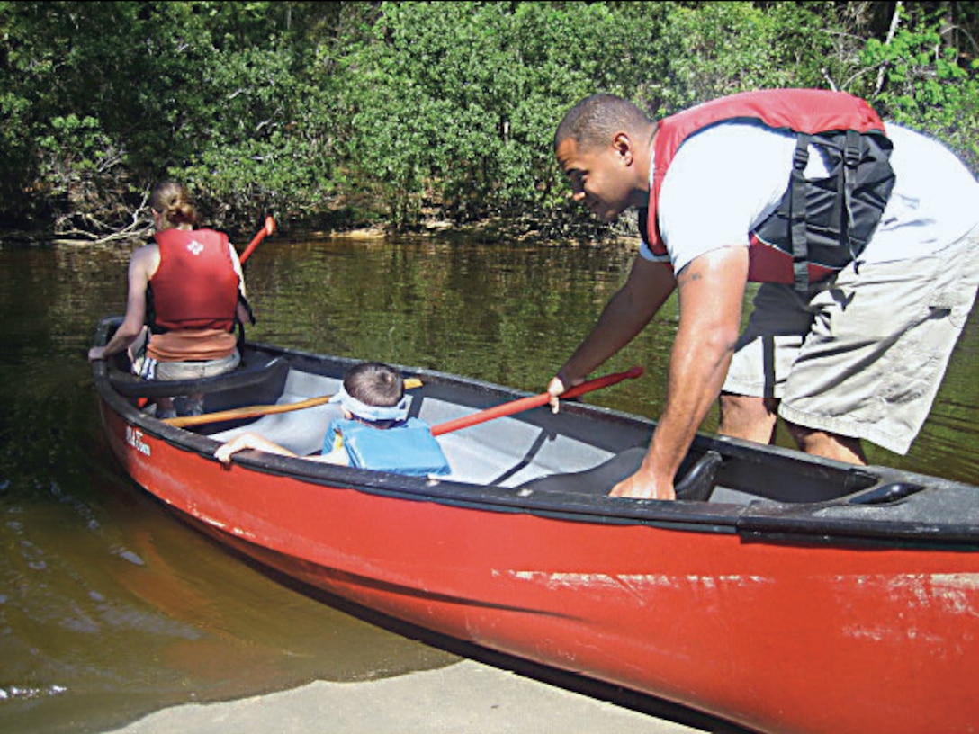A family from Cherry Point, N.C. launches a canoe into the water at Pelican Point Marina. This is one of the types of recreational activities available at some bases. Semper Fit is requesting input from military base personnel about their interests in recreational activities available. For more information, see Marine administrative message 226/14.