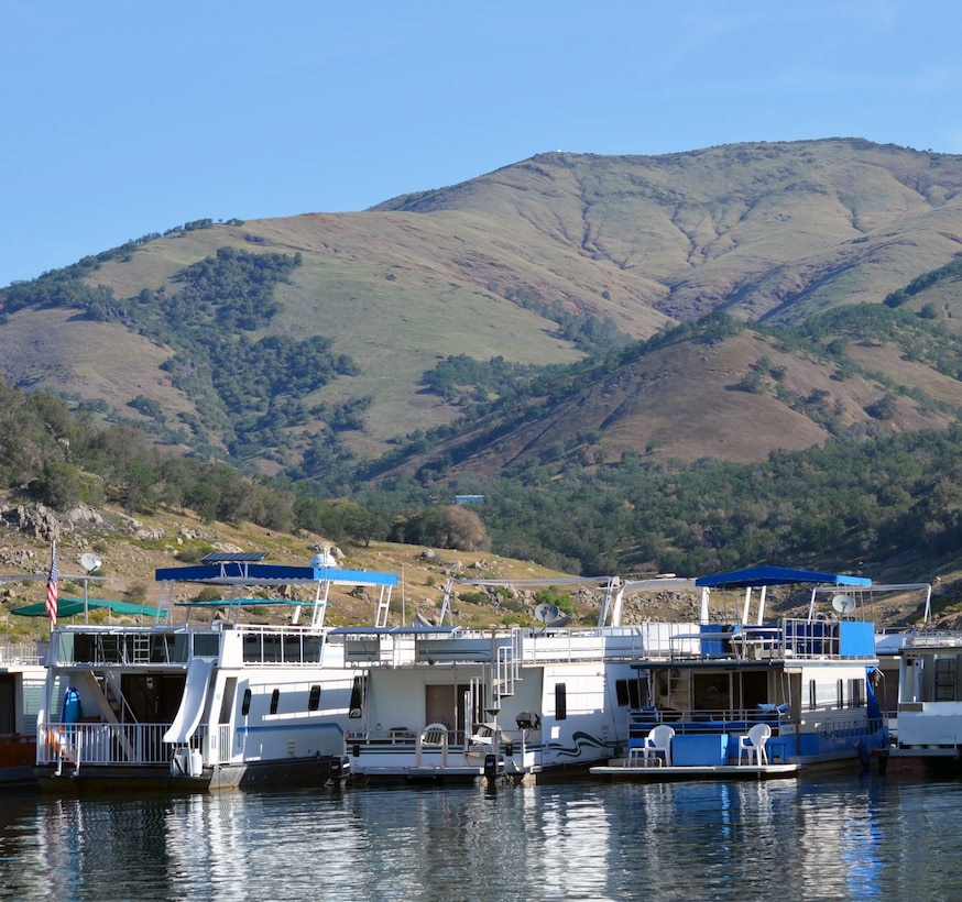 Neighboring houseboats reflect early morning sun on Pine Flat Lake, May 3, 2014.