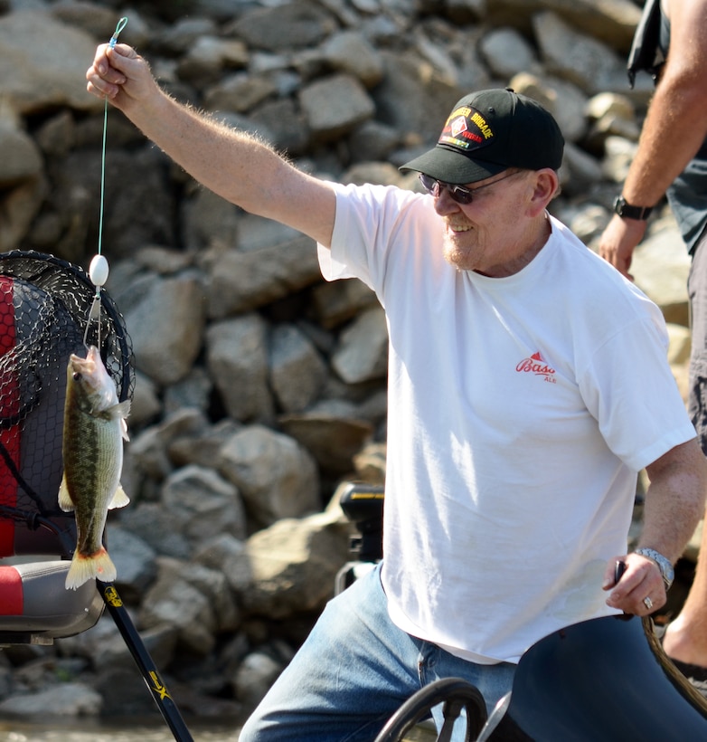 A participant in Take a Warrior Fishing, May 3, 2014, proudly shows his catch from Pine Flat Lake. 