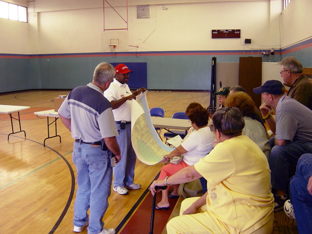 Jacksonville District engineer Tim Brown (second from left) talks with his team during 2005’s Hurricane Wilma recovery.