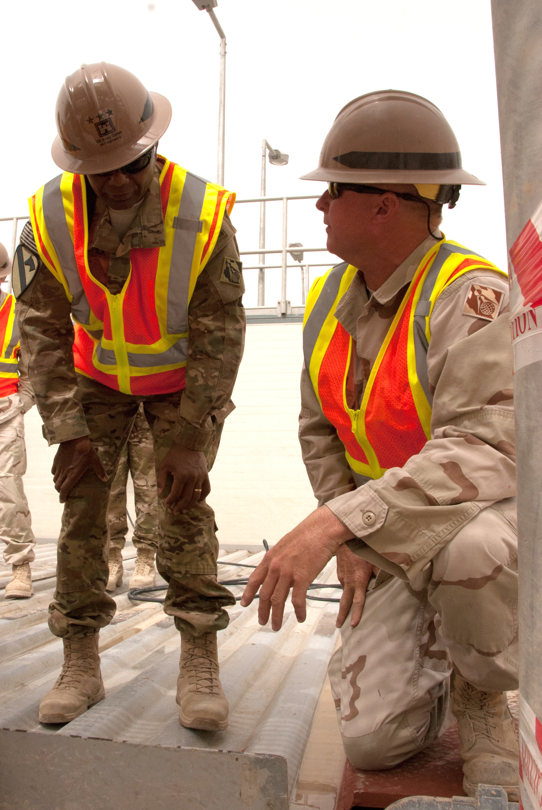 Construction representative Shawn Huebner (right) briefs Lt. Gen