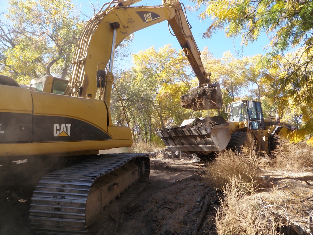 ALBUQUERQUE, N.M., -- An excavator fills a loader after a channel dig Oct. 25, 2012 as part of the Middle Rio Grande Restoration Project in the Bosque near Tingley Ponds. Photo by Jacob Chavez. 