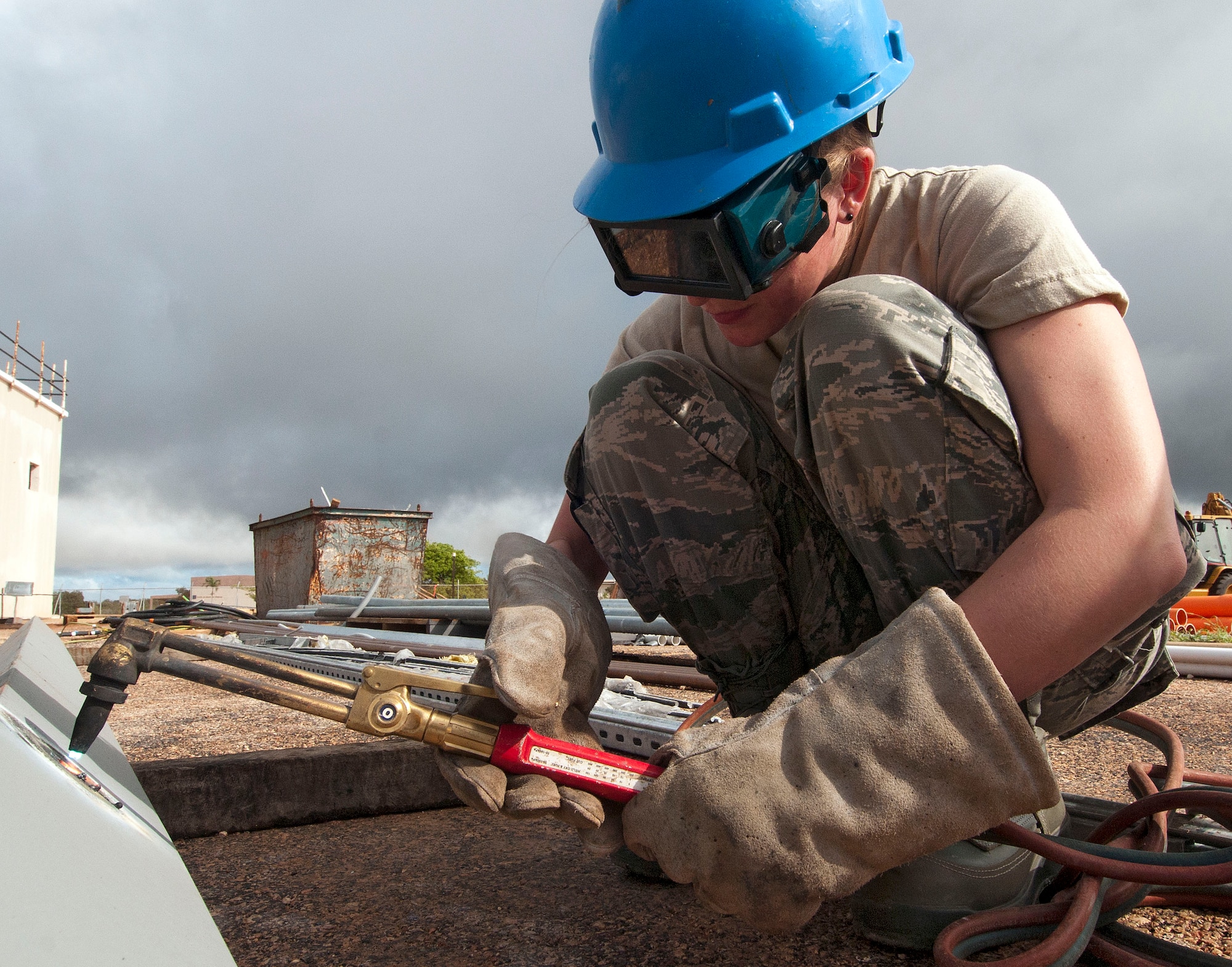 H.E. HOLT NAVAL COMMUNICATION STATION, Australia – Staff Sgt. Kelli Naramore, operations manager for the Alaska Air National Guard’s 176th Civil Engineer Squadron, uses an oxyacetylene torch to cut a hole in a girder here May 6, 2014. Thirty-four Alaska Air Guard members, most from the 176th CES, deployed for two weeks to this tiny outpost at the far western tip of Australia to help build a space radar facility to be jointly operated by Australia and the United States. U.S. Air National Guard photo by Capt. John Callahan/ Released.