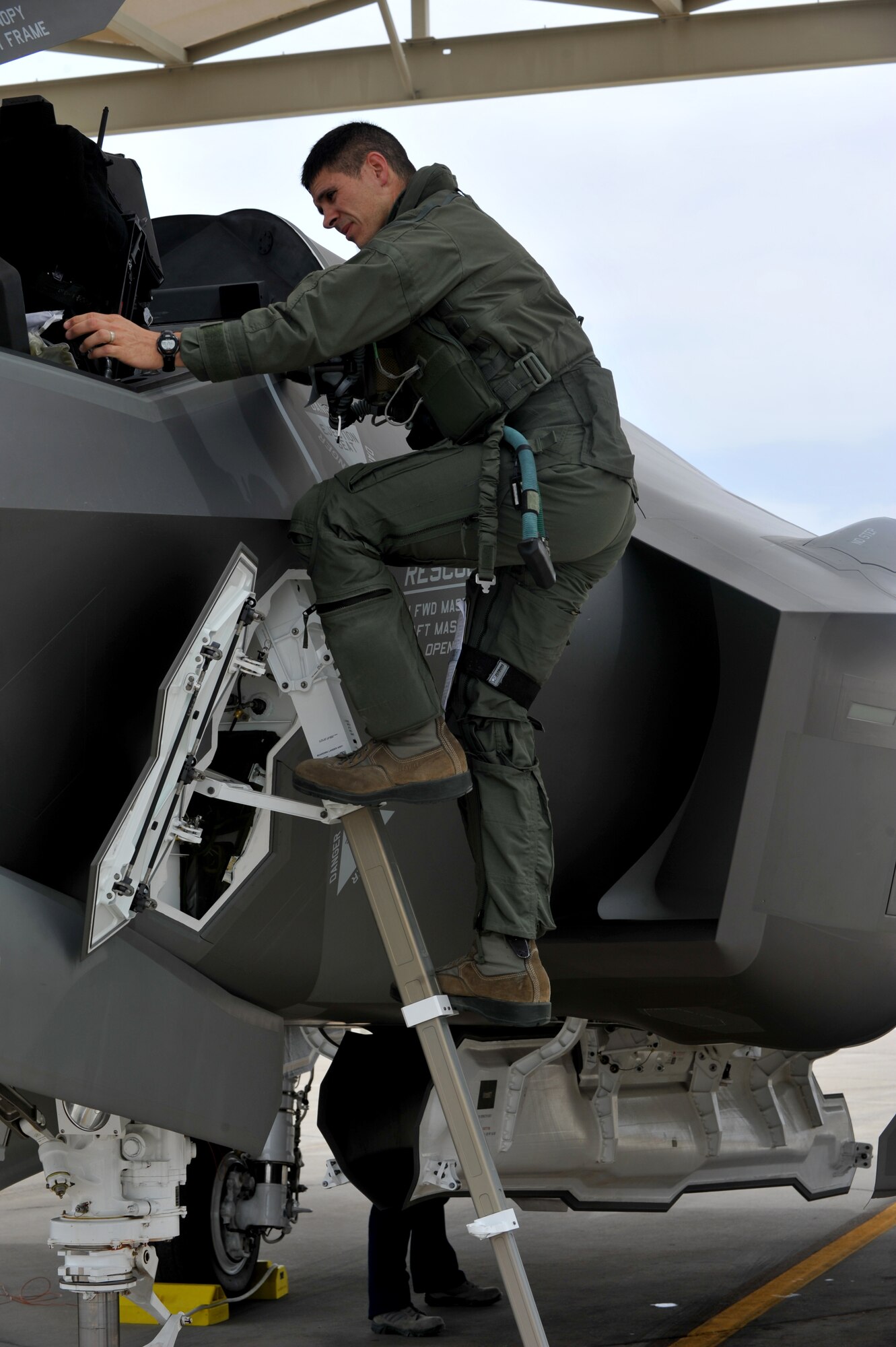 Maj. John Wilson, 61st Fighter Squadron instructor pilot, climbs out of one of Luke Air Force Base’s first F-35 Lightning II May 6, 2014, after flying one of its first sorties. (U.S. Air Force photo by Senior Airman Jason Colbert)
