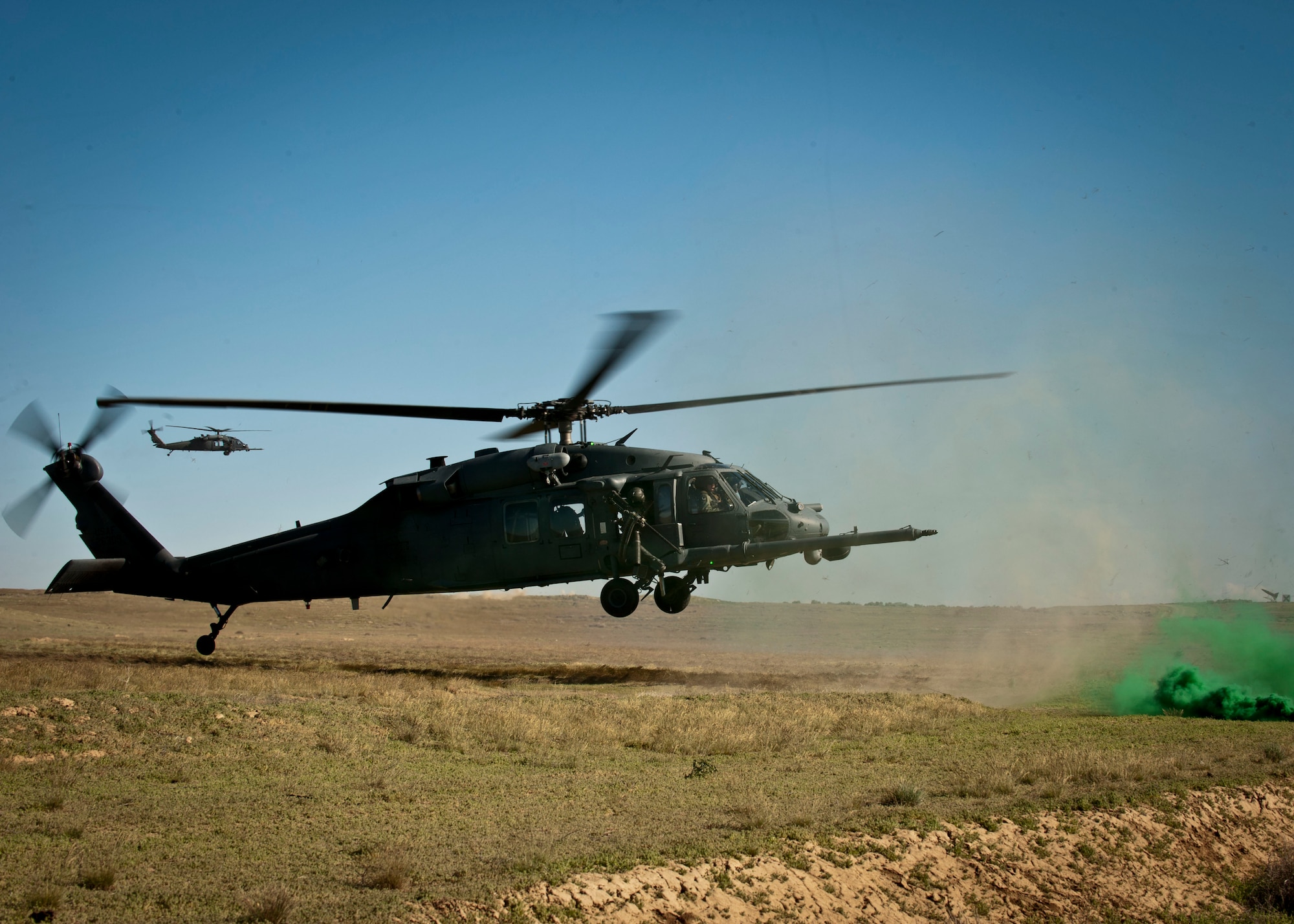 A U.S. Air Force HH-60 Pave Hawk assigned to Nellis Air Force Base, Nev. prepares to land during the terminal employment phase portion of the USAF Weapons School pilot training, April 28, 2014, at Orchard Combat Training Center, Idaho.  The weapons school trains tactical experts in the art of integrated battle-space dominance across the land, air, space and cyber domains. (U.S. Air Force photo by Senior Airman Jason Couillard)