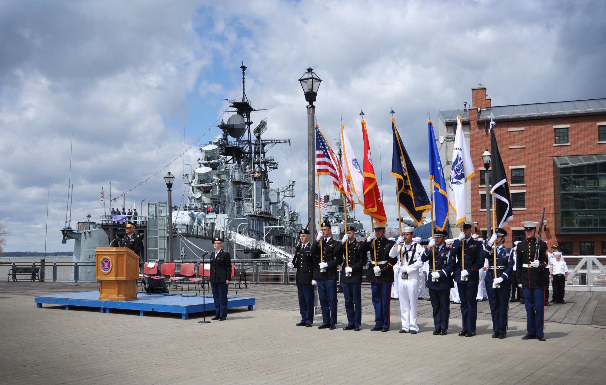 Members of the Joint Color Guard stand at attention as the 54th Annual Western New York Armed Forces Week opening day ceremony commences, May 4, 2014. The ceremony was held at the Buffalo and Erie County Naval and Military Park and marks the start of a week of recognition, saluting veterans past and present. (U.S. Air Force photo by Staff Sgt. Stephanie Clark) 