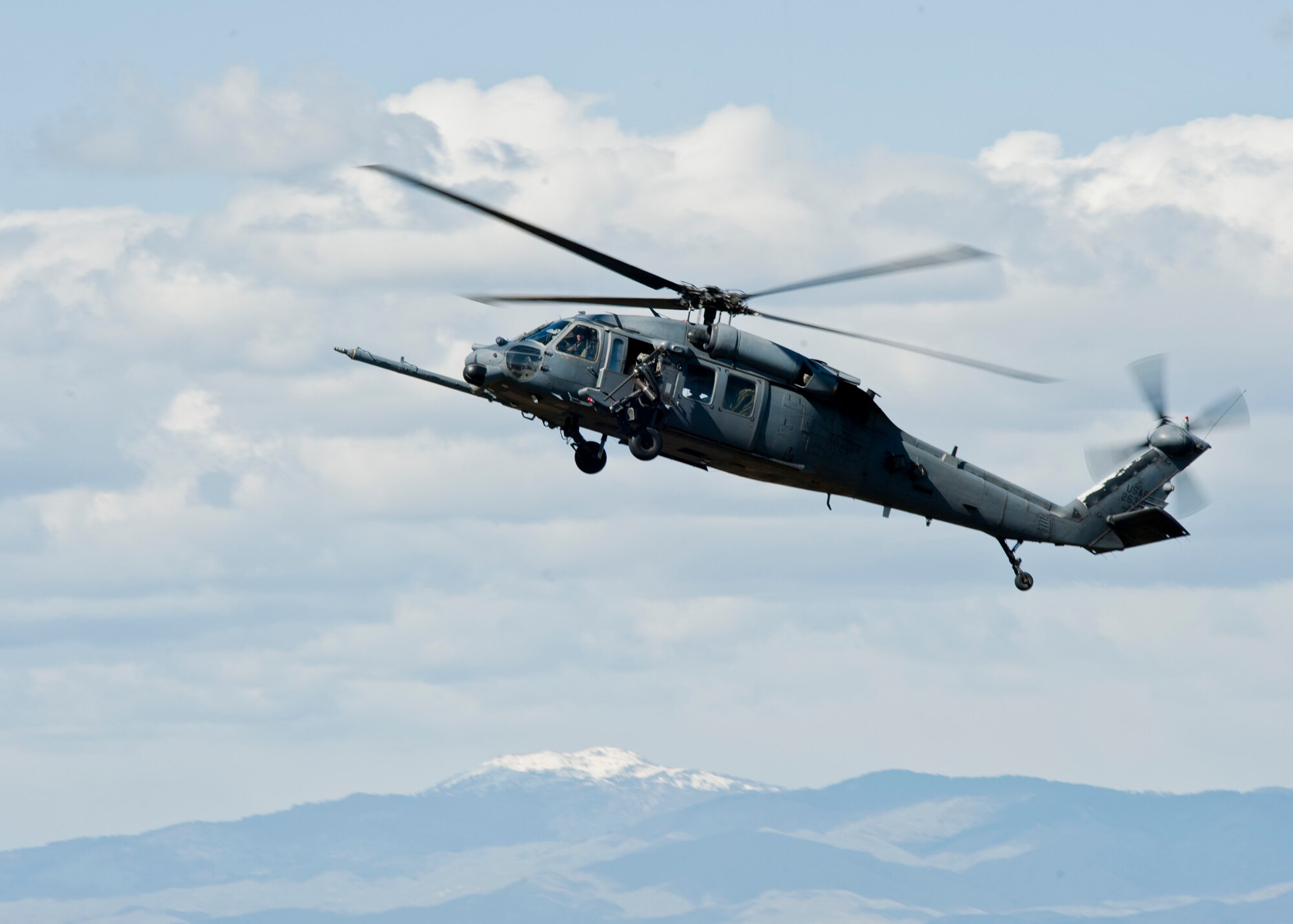 A U.S. Air Force HH-60 Pave Hawk assigned to Nellis Air Force Base, Nev. prepares to land during the U.S. Air Force Weapons School terminal employment phase portion of pilot training April 28, 2014, at Orchard Combat Training Center, Idaho. The TE mission objective is to demonstrate and instruct HH-60 Pave Hawk weapons employment and landing zone options to weapons school students by maximizing weapons proficiency and quickly recover survivors. (U.S. Air Force photo by Senior Airman Jason Couillard)