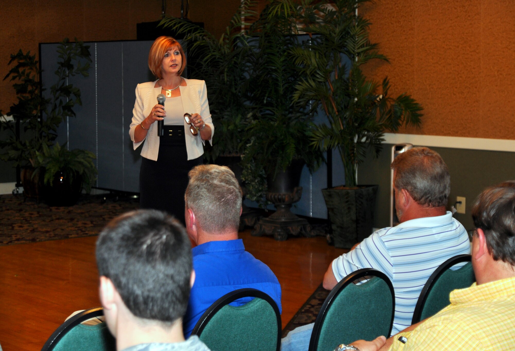 Minol Utility Management associate director, Lisa Poste, speaks to over 125 Columbus Air Force Base housing residents at a town hall meeting hosted by Hunt Family Housing at the Columbus Club April 30. Poste spoke about changes to the utiltiy allowance policy and addressed residents’ concerns regarding billing and usage. (U.S. Air Force photo/ 2nd Lt. Joshua Benedetti)
