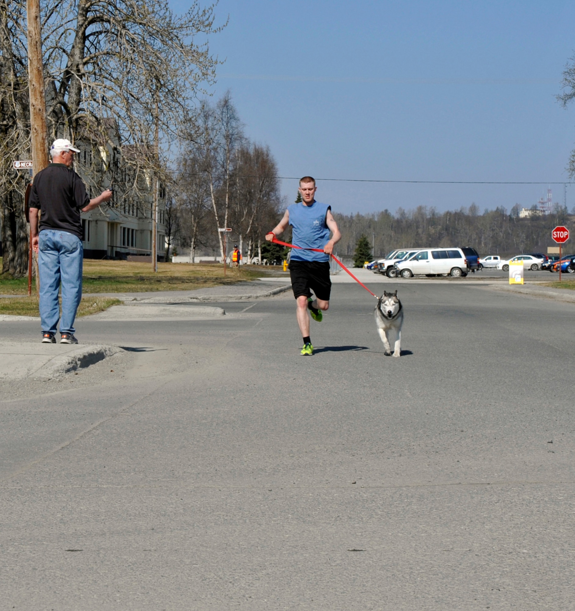 Spc. Michael Cuneo and his Siberian Husky, Rumatin, finish first during the 17th annual Pet Fun Run on Joint Base Elmendorf-Richardson, Alaska, May 3, 2014. More than 20 military members and their families participated in this year???s Pet Fun Run. Cuneo is an infantryman with the 1st Battalion (Airborne), 501st Infantry Regiment. (U.S. Air Force photo/Airman 1st Class Tammie Ramsouer)