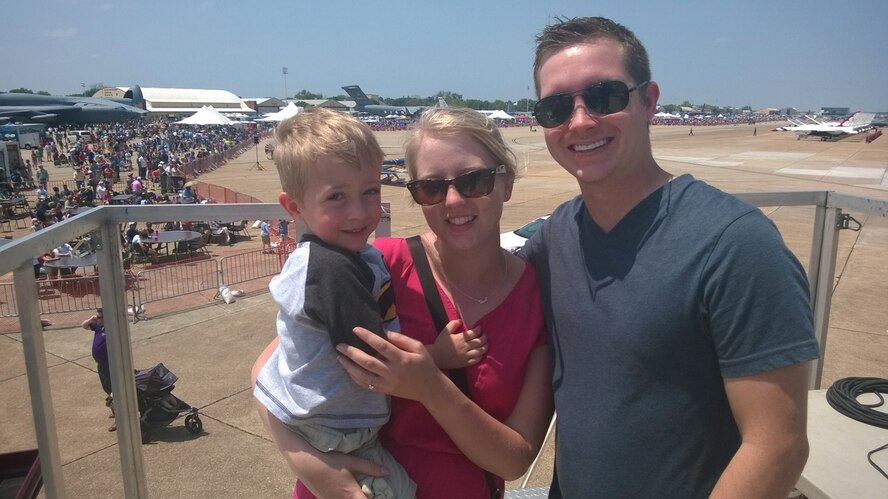 Staff Sgt. Mark Pritchett, 2nd Maintenance Group, his fiancée Chelsea Persons and Pritchett’s son pose for a photograph at the 2014 Defenders of Liberty Air Show on Barksdale Air Force Base, La., April 26, 2014. Pritchett proposed to his girlfriend during the air show after implementing his 24 hour proposal plan; she said yes. (Courtesy photo)