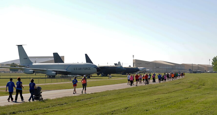 Participants from the 3rd Annual Mighty Eighth 8k run through the Barksdale Global Power Museum airpark on Barksdale Air Force Base, La., May 3, 2014. The annual fun run consisted of an 8k and 5k and was open to all authorized base personnel and sponsored guests. (U.S. Air Force photo/Senior Airman Benjamin Gonsier)
