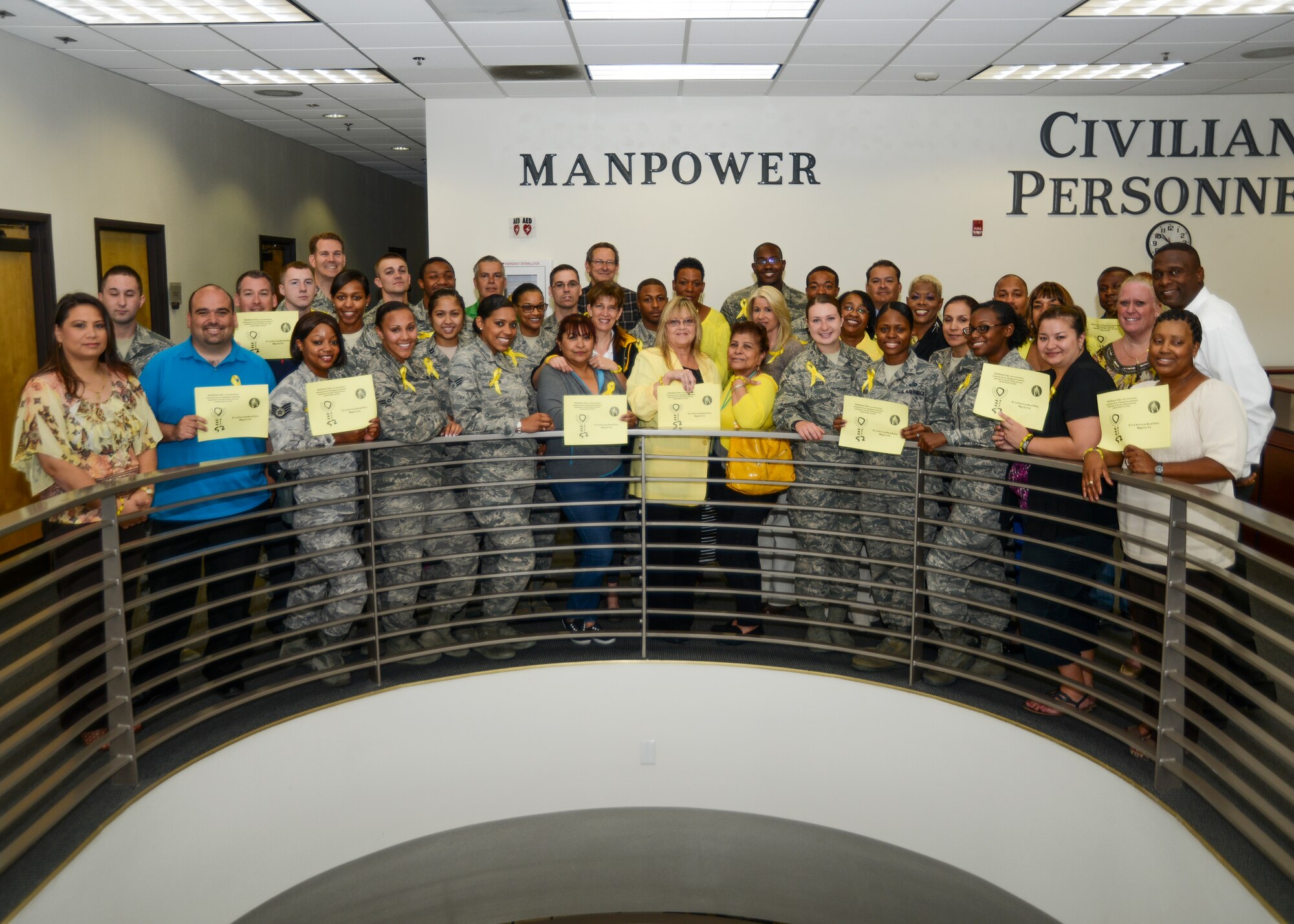 Bldg. 3000 personnel wore yellow clothes, bracelets, ribbons and passed out flyers to spark conversation about Wishbone Day, which raises awareness for Osteogenesis Imperfecta, also known as “brittle bone” disease. (U.S. Air Force photo by Rebecca Amber)