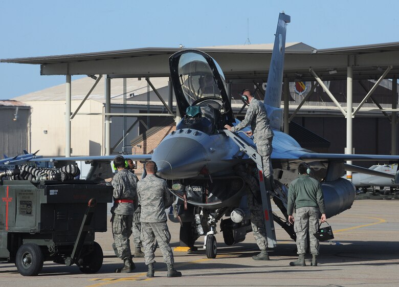 F-16 maintainers from Shaw Air Force Base, S.C., check out one of their aircraft May 6 at Hill AFB. Aircraft from Shaw and other units are participating May 5-15 in an the Air Force Weapon System Evaluation program air-to-ground exercise known as "Combat Hammer." During the exercise, the units will drop munitions in realistic combat scenarios at the Utah Test and Training Range. (U.S. Air Force photo by Alex R. Lloyd)