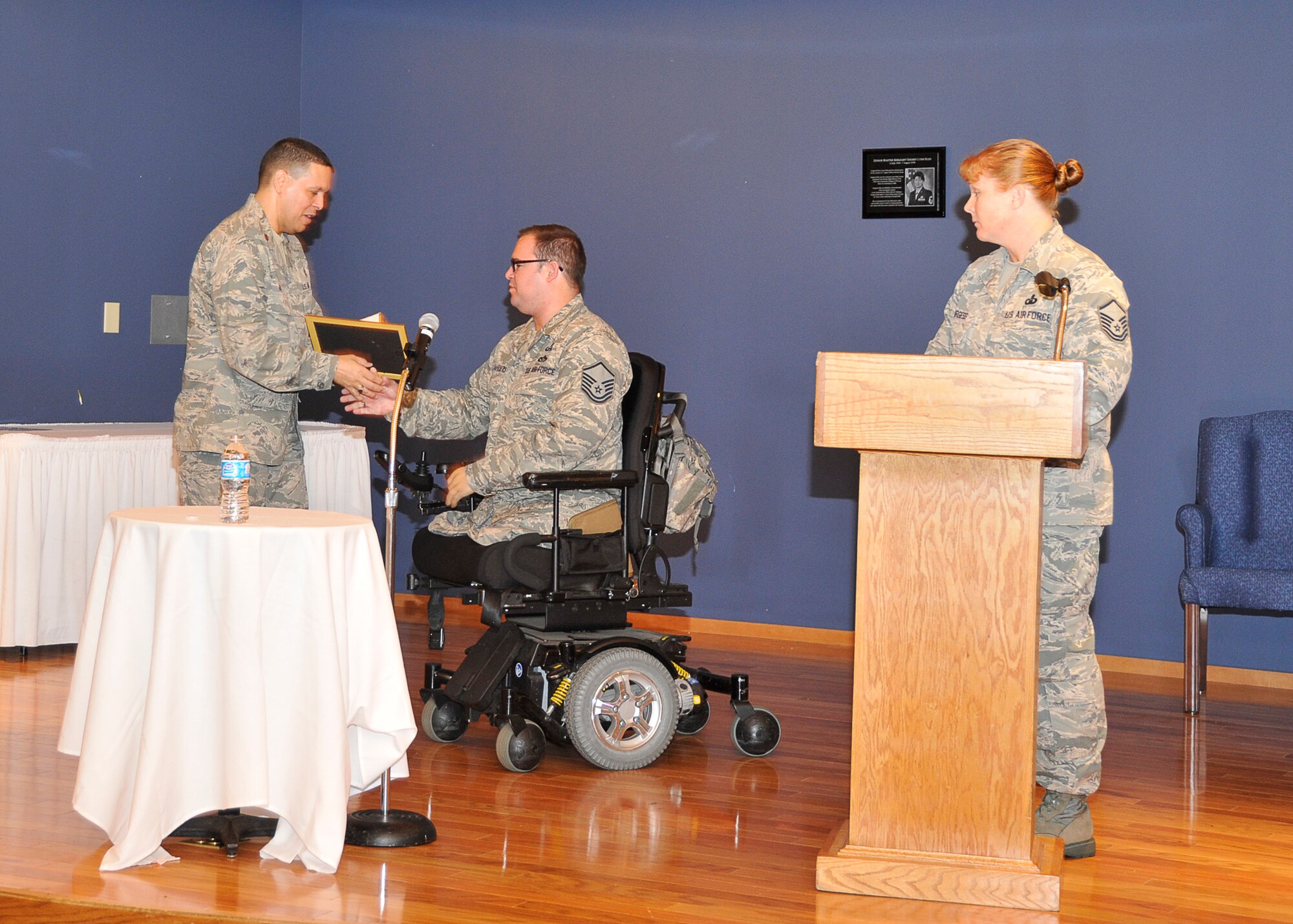 Maj. Gabriel Rios, 325th Fighter Wing senior faith Protestant Chaplin, presents Master Sgt. Joseph Deslauriers, Air Force Special Operations Command Headquarters Explosive Ordinance Disposal program manager, a token of appreciation May 1 for being a guest speaker at the Annual National Prayer Breakfast. The National Prayer Breakfast is held the first Thursday of May. (U.S. Air Force photo by Airman 1st Class Solomon Cook)