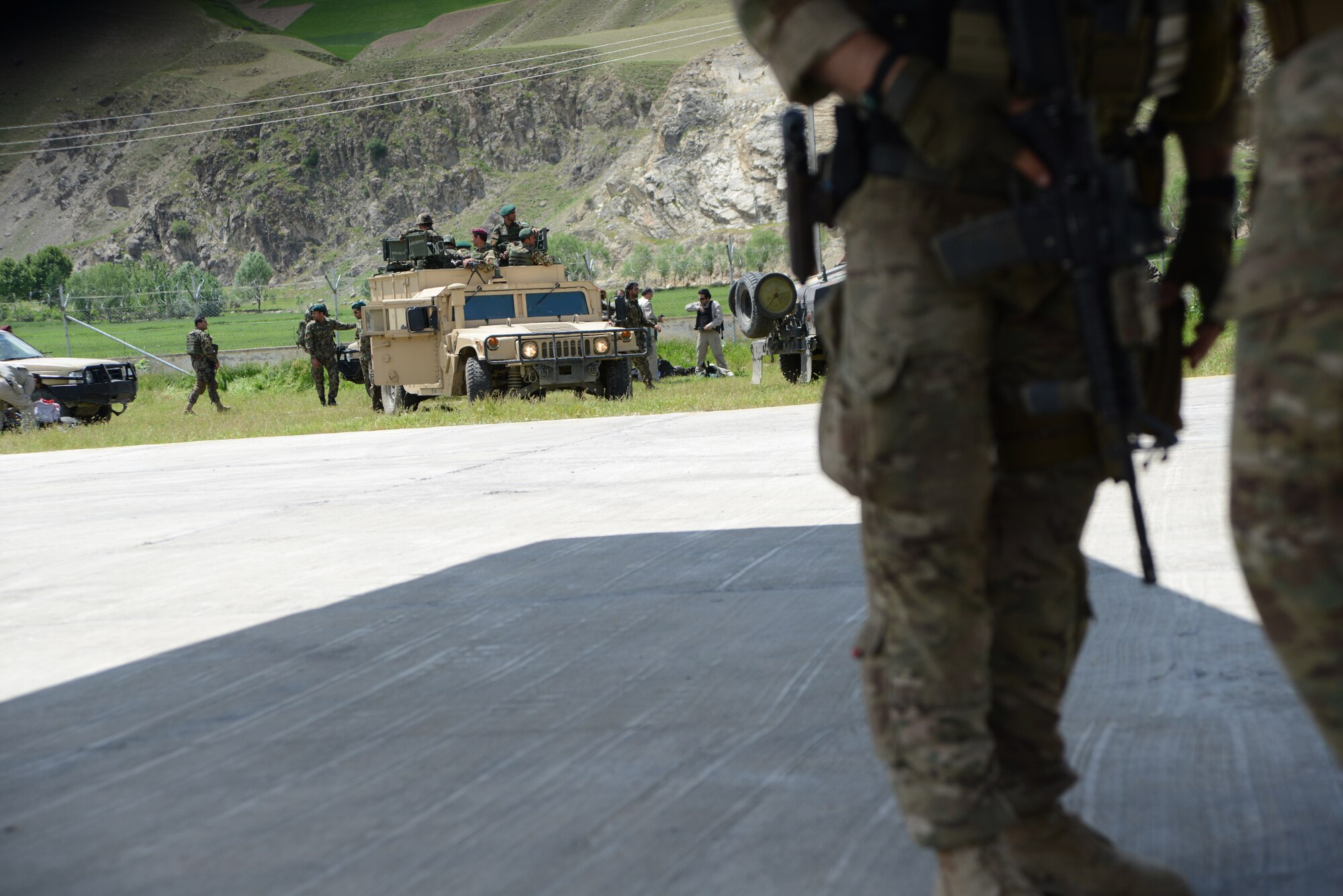 FAYZABAD, Afghanistan – Afghan National Army soldiers prepare to leave the Fayzabad Airport after picking up personnel and unloading humanitarian supplies delivered by a C-130 J-30 crew May 5, 2014. Coalition Forces to include an Italian C-130 and a crew assigned to the 774th Expeditionary Airlift Squadron assisted the Afghan Government with relief efforts after a recent mudslide in Badakhshan province. (U.S. Air Force photo by Master Sgt. Cohen A. Young)
