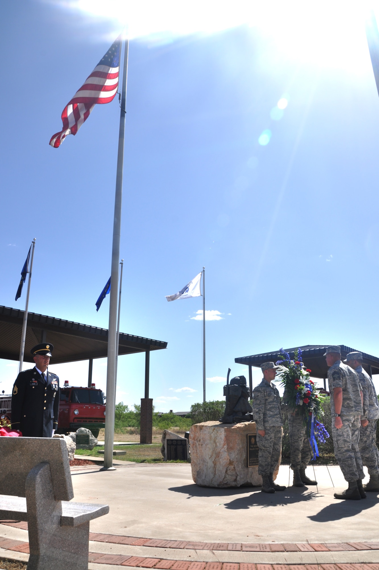 GOODFELLOW AIR FORCE BASE, Texas – Lt. Col. Derek R. Ferland, 312th Training Squadron Commander, and Chief Master Sgt. Albert L. Sisco Jr., 312th Training Squadron superintendent, stand in front of a wreath during a memorial ceremony at the Department of Defense Fallen Firefighters Memorial here May 2. This memorial displays names of other DOD firefighters who lost their lives. (U.S. Air Force photo/ Airman 1st Class Breonna Veal)