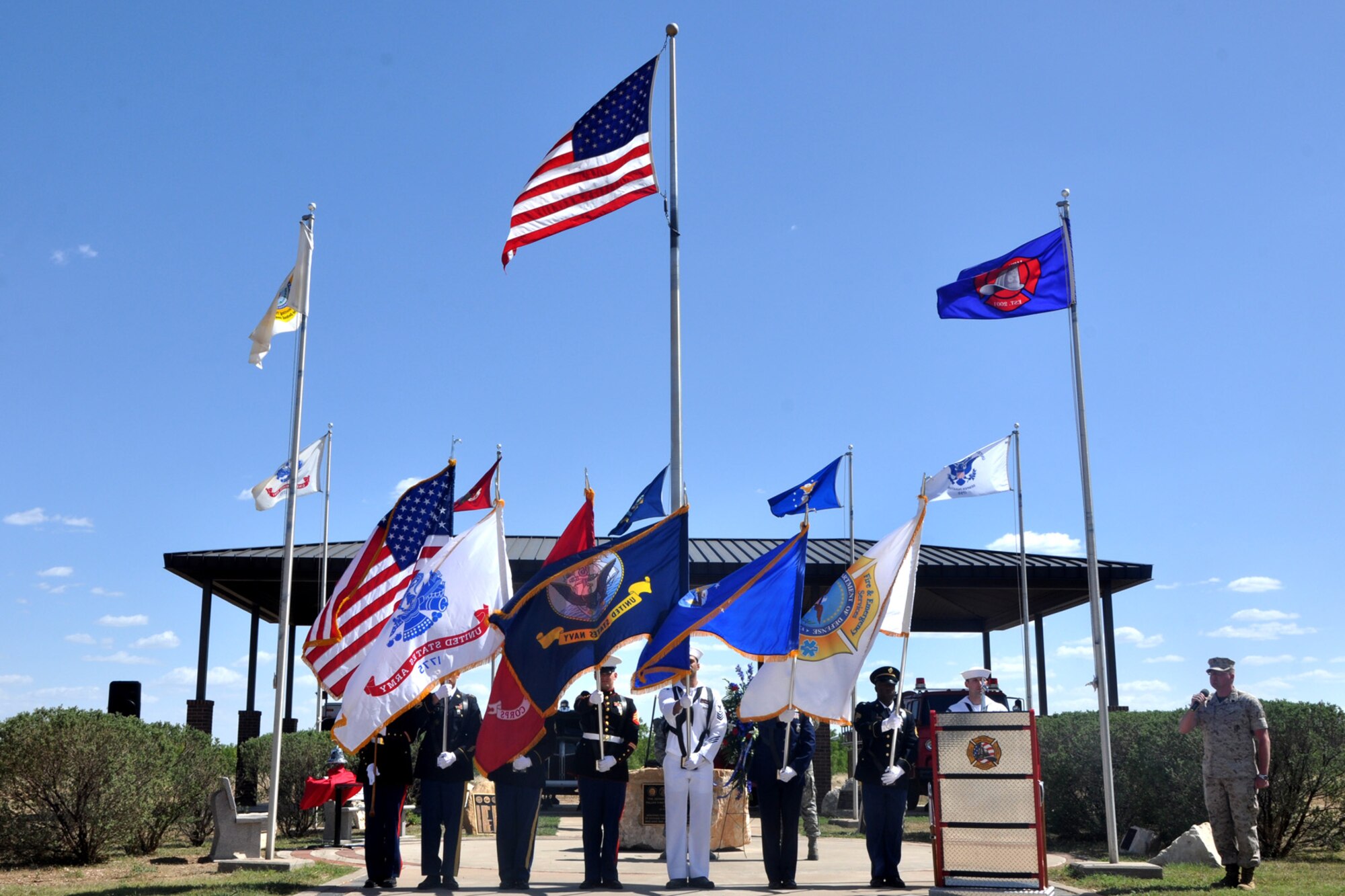 GOODFELLOW AIR FORCE BASE, Texas – The joint service color guard present the colors during the singing of the national anthem for a memorial service of three deceased firefighters at the Department of Defense Fallen Firefighters Memorial here May 2. The ceremony included a moment of silence, a wreath laying and words spoken in remembrance of the fallen firefighters. (U.S. Air Force photo/ Airman 1st Class Breonna Veal)